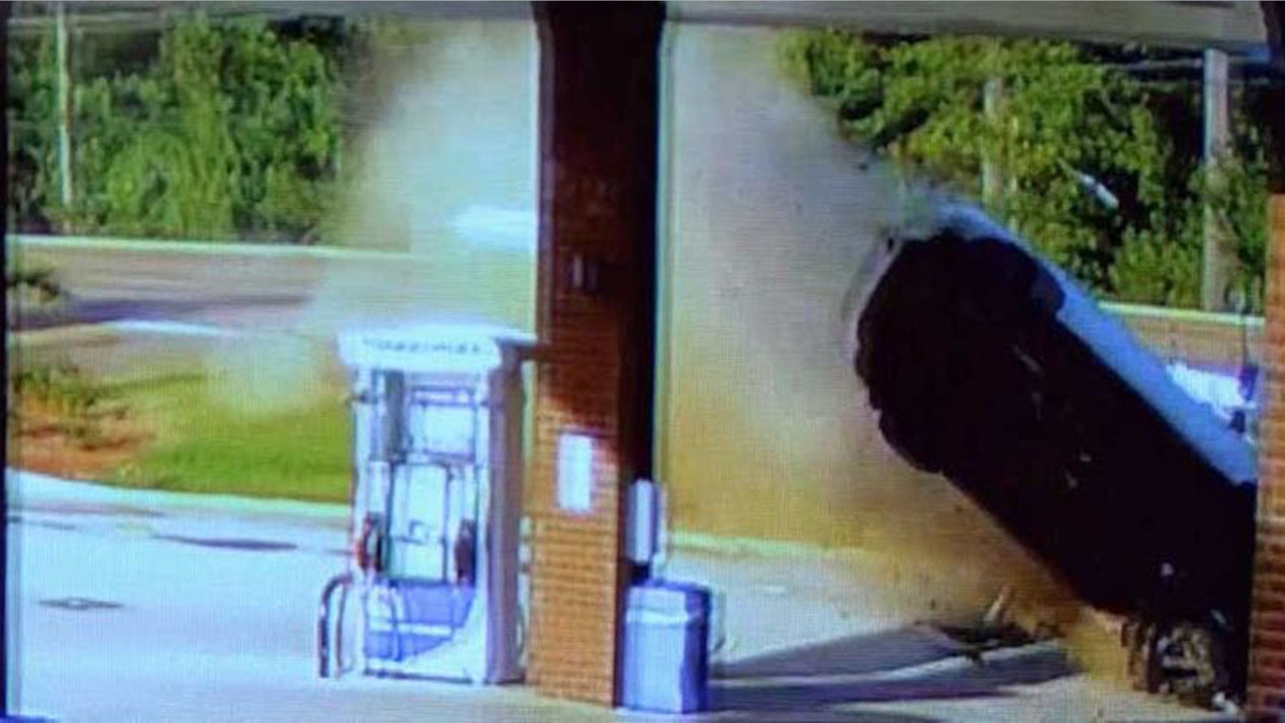 Image from video showing an out-of-control car crashing into a gas station in Flowood, Miss., Thursday.