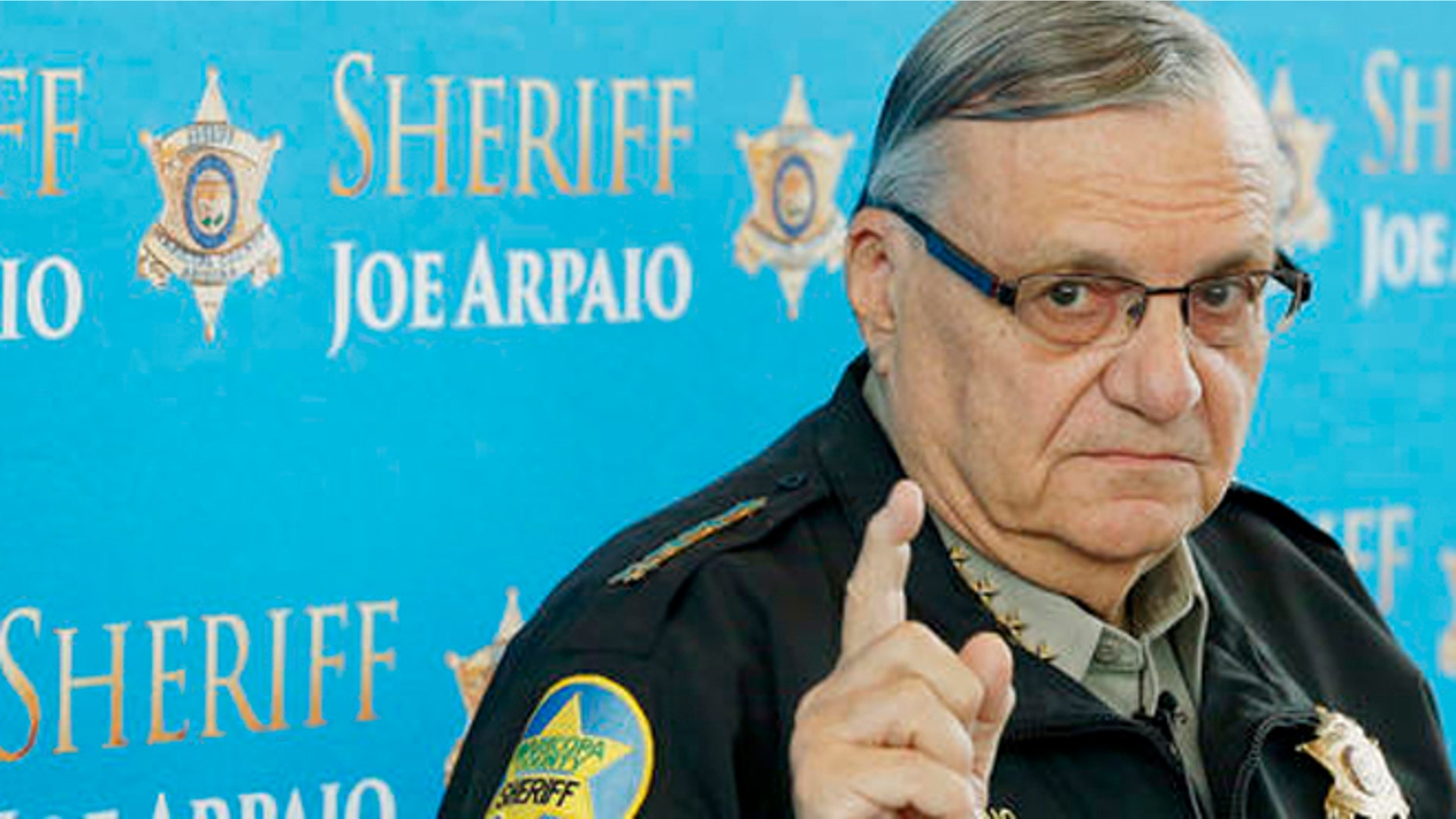 FILE - In this Dec. 18, 2013, file photo, Maricopa County Sheriff Joe Arpaio speaks at a news conference at the Sheriff's headquarters in Phoenix, Ariz. The sheriff of metropolitan Phoenix has raised close to $10 million in his bid for a seventh term, a stunning collection of campaign riches for a local police race. Much of the money contributed to Arpaio was donated by a devoted base of backers who live outside Arizona. (AP Photo/Ross D. Franklin, File)