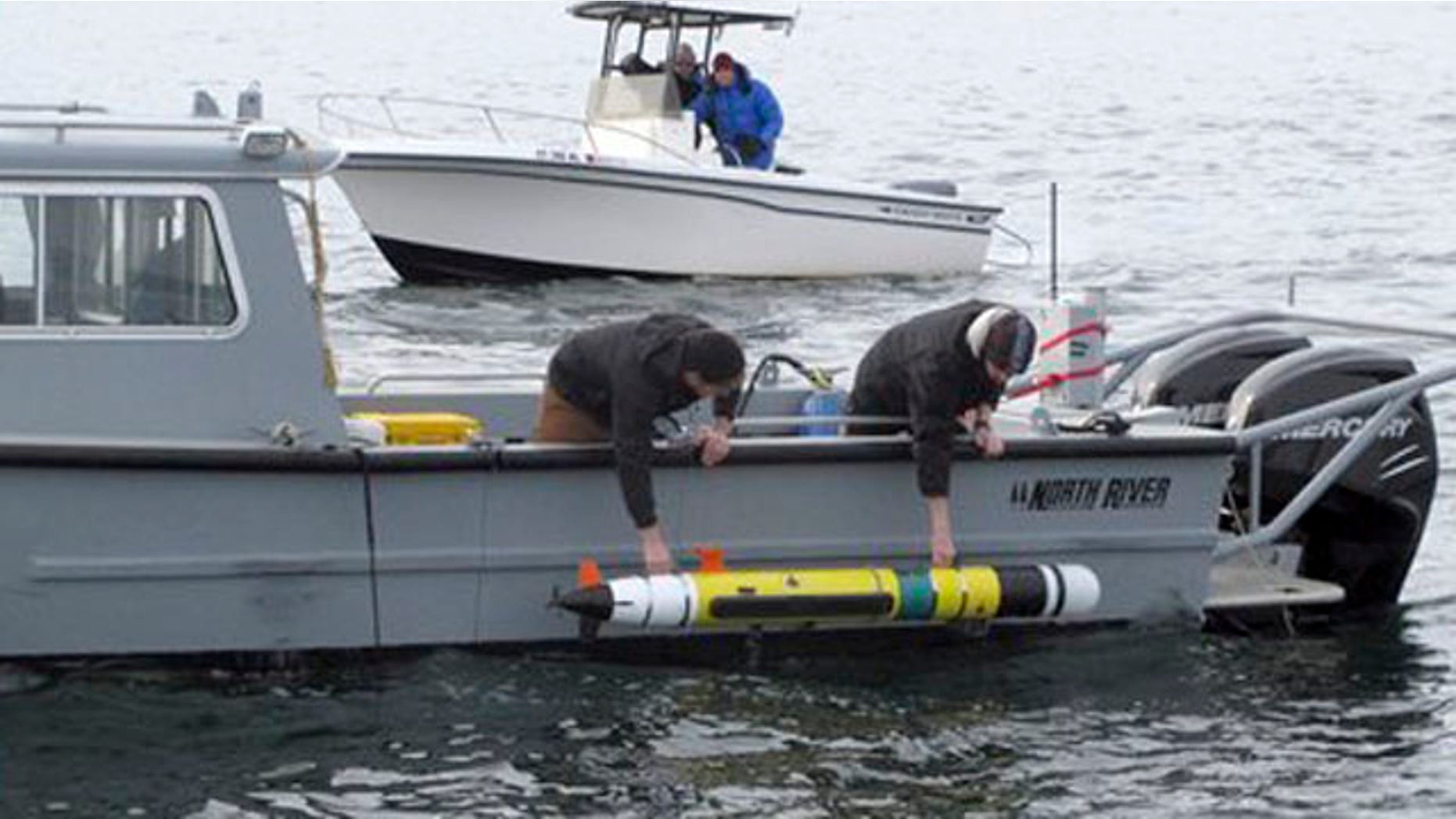 Feb. 8, 2012: Researchers lower an underwater robot into Block Island Sound off the Westerly, R.I., coast.