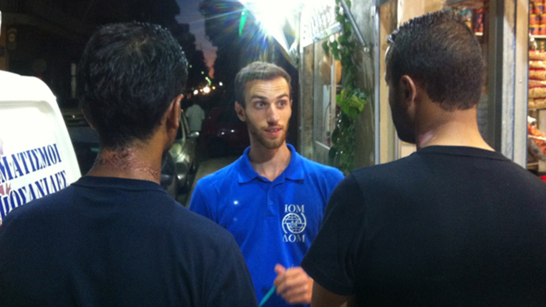 Two Palestinian survivors speak to a member of the International Organization for Migration, following the sinking of a migrant vessel carrying roughly 500 people off the coast of Malta. The men, who were interviewed in Crete, are seen with burn marks from the sun on their necks. The two, who had life vests, were rescued two days later by a Panamanian-flagged merchant vessel.