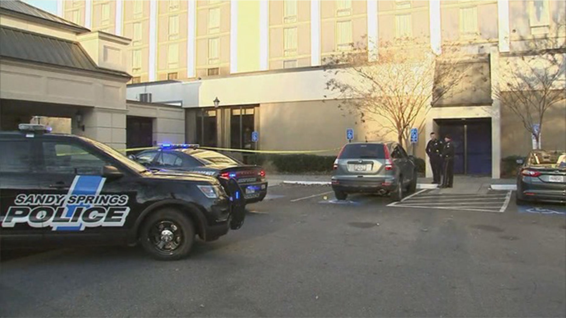 An FBI agent attempted to make an arrest at a hotel Friday in Sandy Springs, Ga., when he got caught on a truck being driven by the suspect and subsequently dragged through the Atlanta suburb.