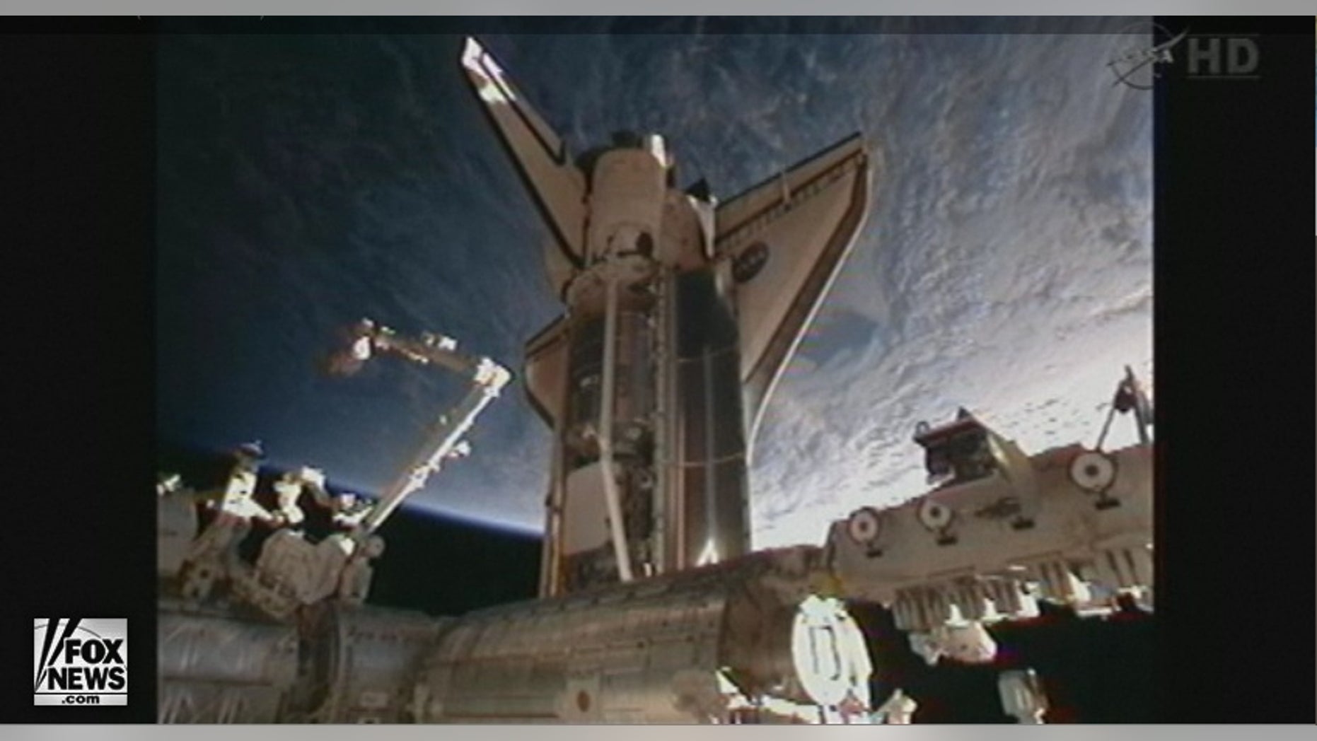 Space shuttle Discovery docked with the International Space Station at 2:14 p.m. EST Saturday.