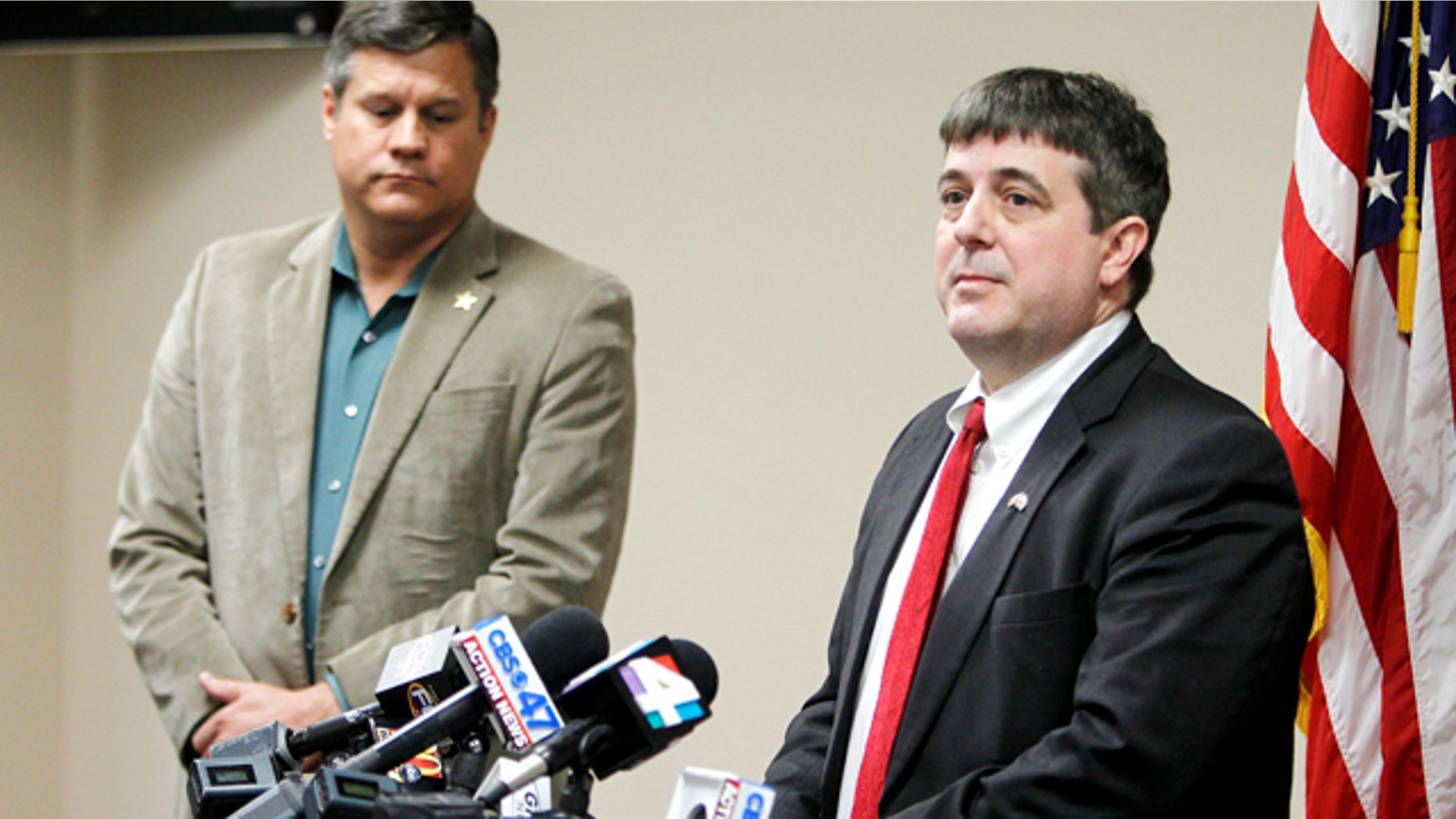 Jan. 7, 2015: Columbia County State Attorney Jeff Seigmeister speaks during a press conference in Lake City, Fla. about two Columbia County girls accused of killing their brother. Columbia County Sheriff Mark Hunter, left, also spoke. (AP Photo/Matt Stamey, The Gainesville Sun)
