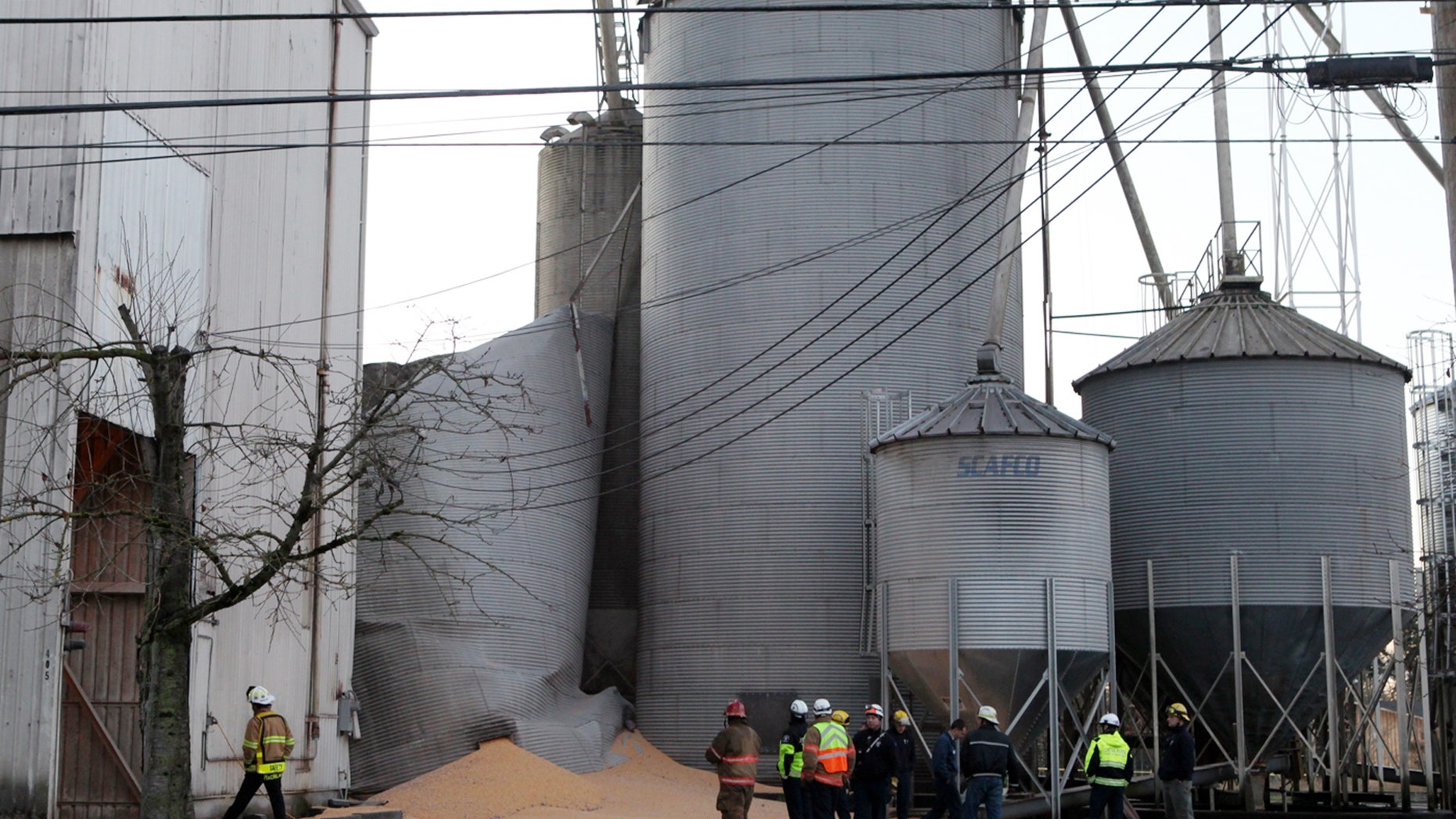 Dec. 2, 2013: Emergency responders from the South Pierce Fire Department respond to a grain processing feed mill owned by Wilcox Farms in downtown Roy, Wash. after one of its silos collapsed.