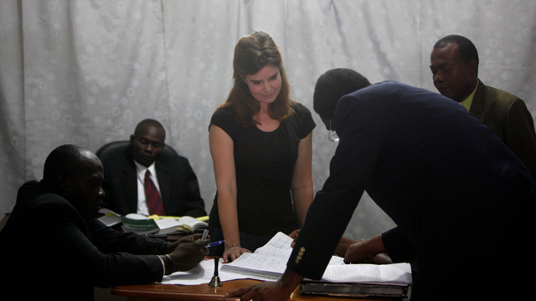 May 13: U.S. missionary Laura Silsby, center, appears in a Port-au-Prince courthouse on the first day of her trial.