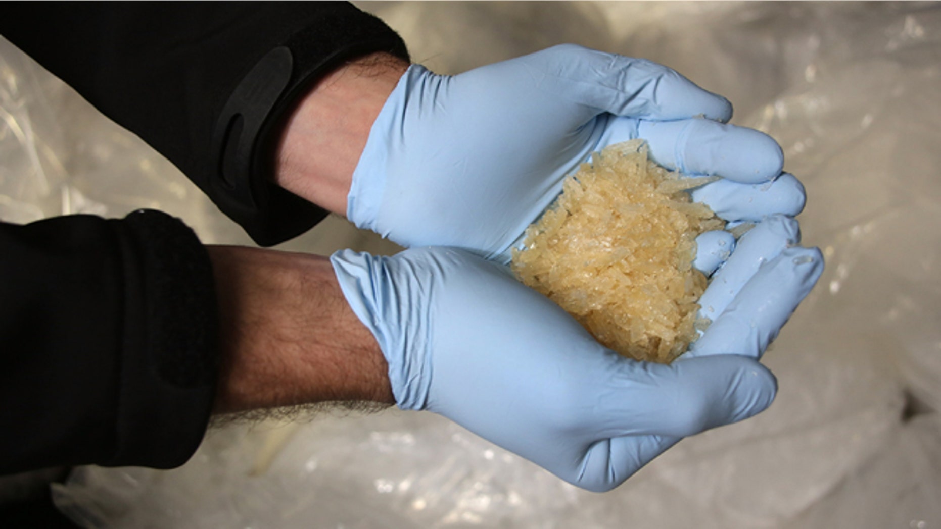 WIESBADEN, GERMANY - NOVEMBER 13: Members of the Bundeskriminalamt German law enforcement agency (BKA), the Federal Criminal Office, display portions of 2.9 tonnes of recently-confiscated chlorephedrin, one of the main ingredients used to manufacture methamphetamine, also called crystal meth, at a press conference on November 13, 2014 in Wiesbaden, Germany. Police from Saxony, Thuringia and the Czech Republic broke a crystal meth manufacturing ring earlier this month and confiscated the haul, which is enough to produce 2.3 tonnes of crystal meth, and also made at least 16 arrests, including the ring leader, a 32-year-old pharmaceuticals retailer from Leipzig. Crystal meth has evolved into a major scourge in the Czech-German border region and is becoming a popular drug in cities deeper inside Germany. (Photo by Hannelore Foerster/Getty Images)