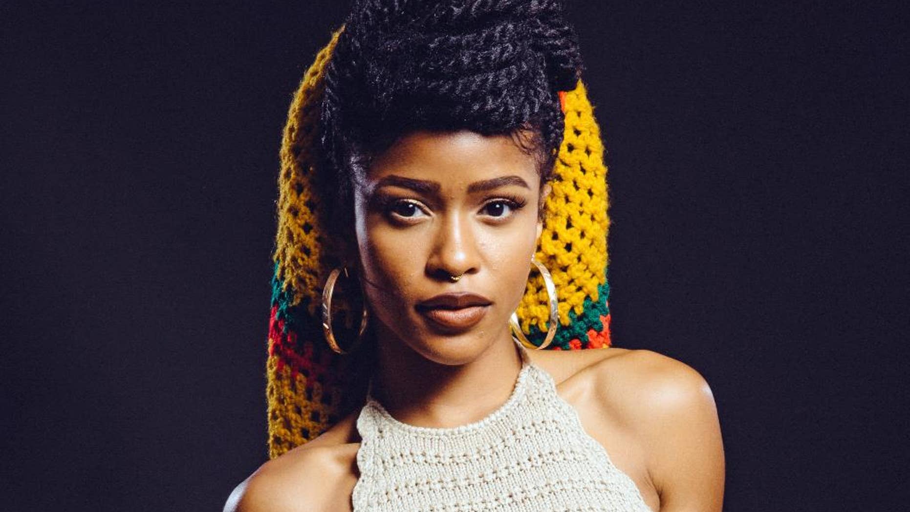 FILE - In this Tuesday, July 22, 2014 file photo, Simone Battle of the band G.R.L. at The Beverly Hilton in Beverly Hills, Calif. Battle was found dead in her West Hollywood, Calif., home Friday morning, Sept. 5, 2014. Battle gained notoriety through performances on the television show "X Factor," and her band G.R.L. had been signed by mega-hit maker Dr. Luke. The Los Angeles County Coroner's Department says an autopsy will be performed Sunday. (AP Photo/Casey Curry/Invision/AP, File)
