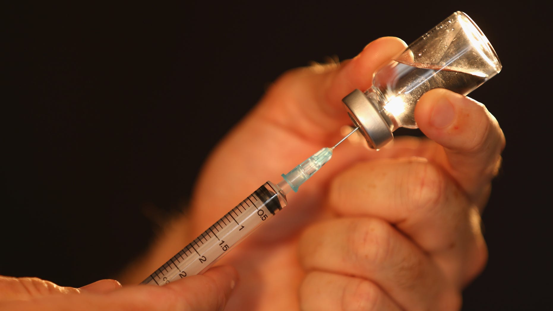 MELBOURNE, AUSTRALIA - FEBRUARY 21: Liquid is extraced from a medical vial with a syringe on February 21, 2013 in Melbourne, Australia. The Australian Crime Commission on Thursday released findings from a 12 month investigation into Australian sport, uncovering the possibility of match fixing, drugs in sport and links to organised crime. (Photo by Robert Cianflone/Getty Images)