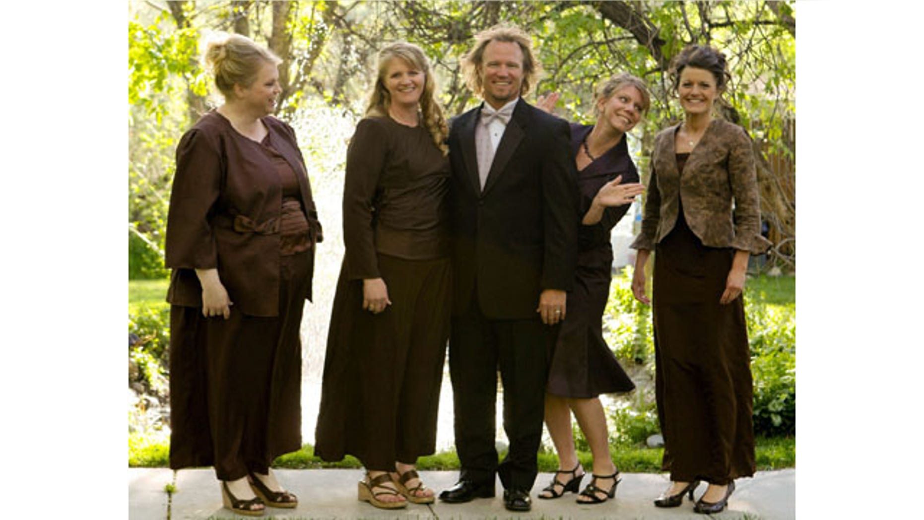 FILE - In this undated file photo provided by TLC, Kody Brown, center, poses with his wives, from left, Janelle, Christine, Meri, and Robyn in a promotional photo for TLC's reality TV show, "Sister Wives." Advocacy groups for polygamy and individual liberties on Saturday, Dec. 14, 2013, hailed a federal judge's ruling that key parts of Utah's polygamy laws are unconstitutional, saying it will remove the threat of arrest for those families. (AP Photo/TLC)