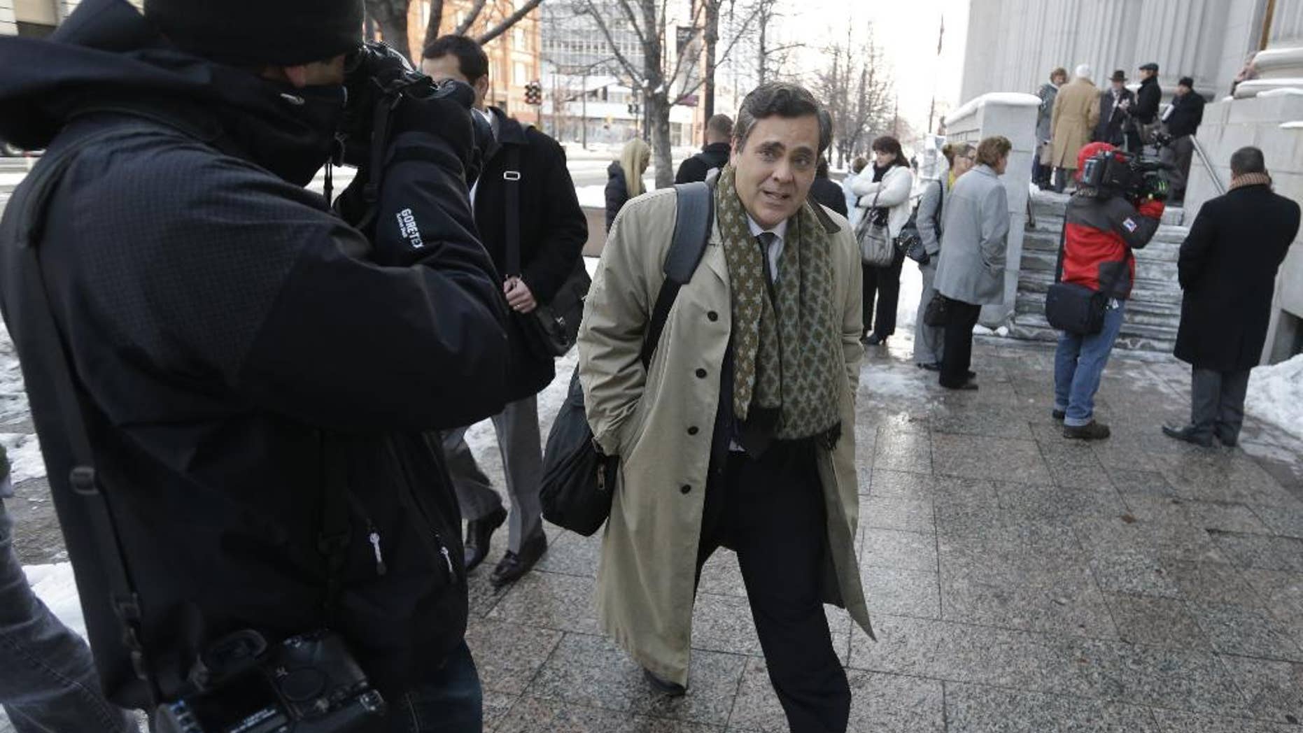 FILE - In this Jan. 17, 2013, file photo, Jonathan Turley, attorney for Kody Brown and his four wives, the stars of the reality show "Sister Wives," leaves the Frank E. Moss United States Courthouse after a hearing on whether Utah can prohibit plural marriage, in Salt Lake City. A federal judge in Utah has issued a final ruling that strikes down parts of the state's anti-polygamy law, in a lawsuit filed by a family that appears on the TV show "Sister Wives." The Brown family was overwhelmed and thankful for the ruling, said their attorney, Turley. (AP Photo/Rick Bowmer, File)