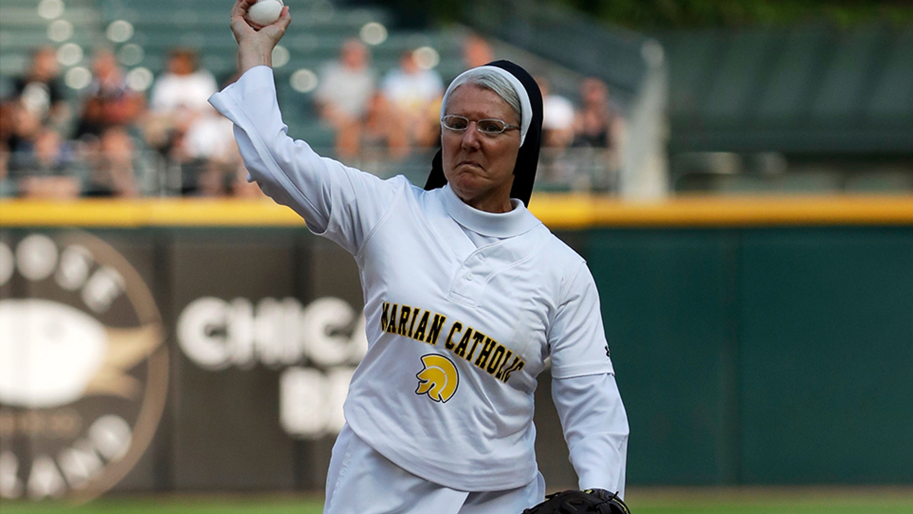 Sister Mary Jo Sobieck throws out a ceremonial first pitch before a baseball game between the Kansas City Royals and the Chicago White Sox, Saturday, Aug. 18, 2018, in Chicago. (AP Photo/Nam Y. Huh)