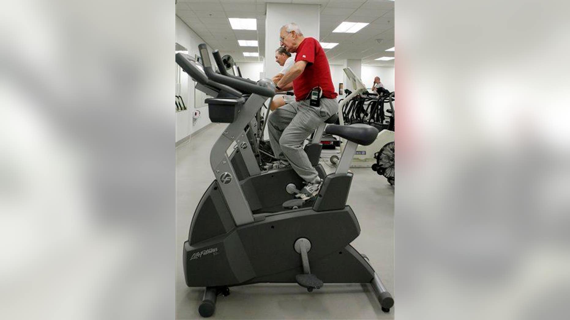 A cardiac patient rides an exercise bike at the Cleveland Clinic in this file photo.