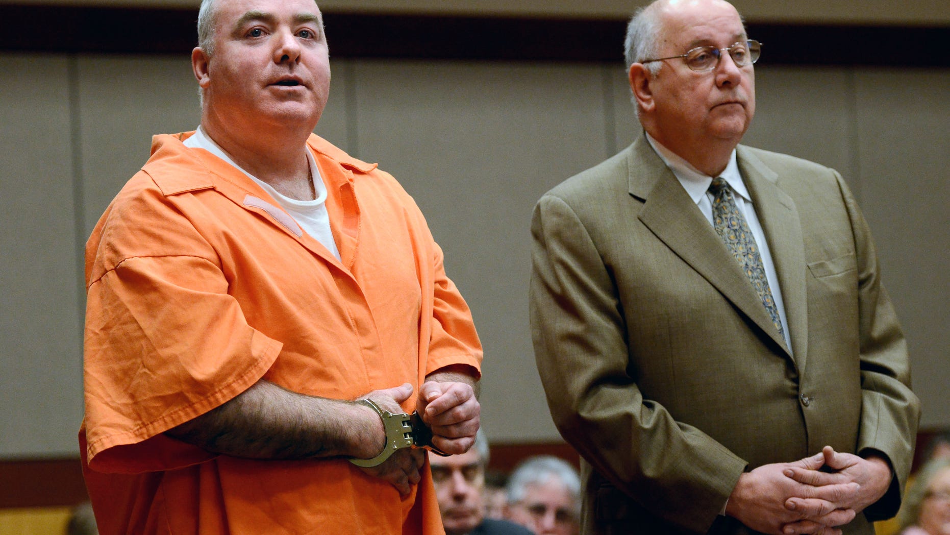 January 24: Michael Skakel, left, addresses the court with attorney his Hubert Santos in Middletown, Connecticut. Skakel is seeking a reduction in his sentence of 20 years to life in prison for killing his neighbor Martha Moxley.