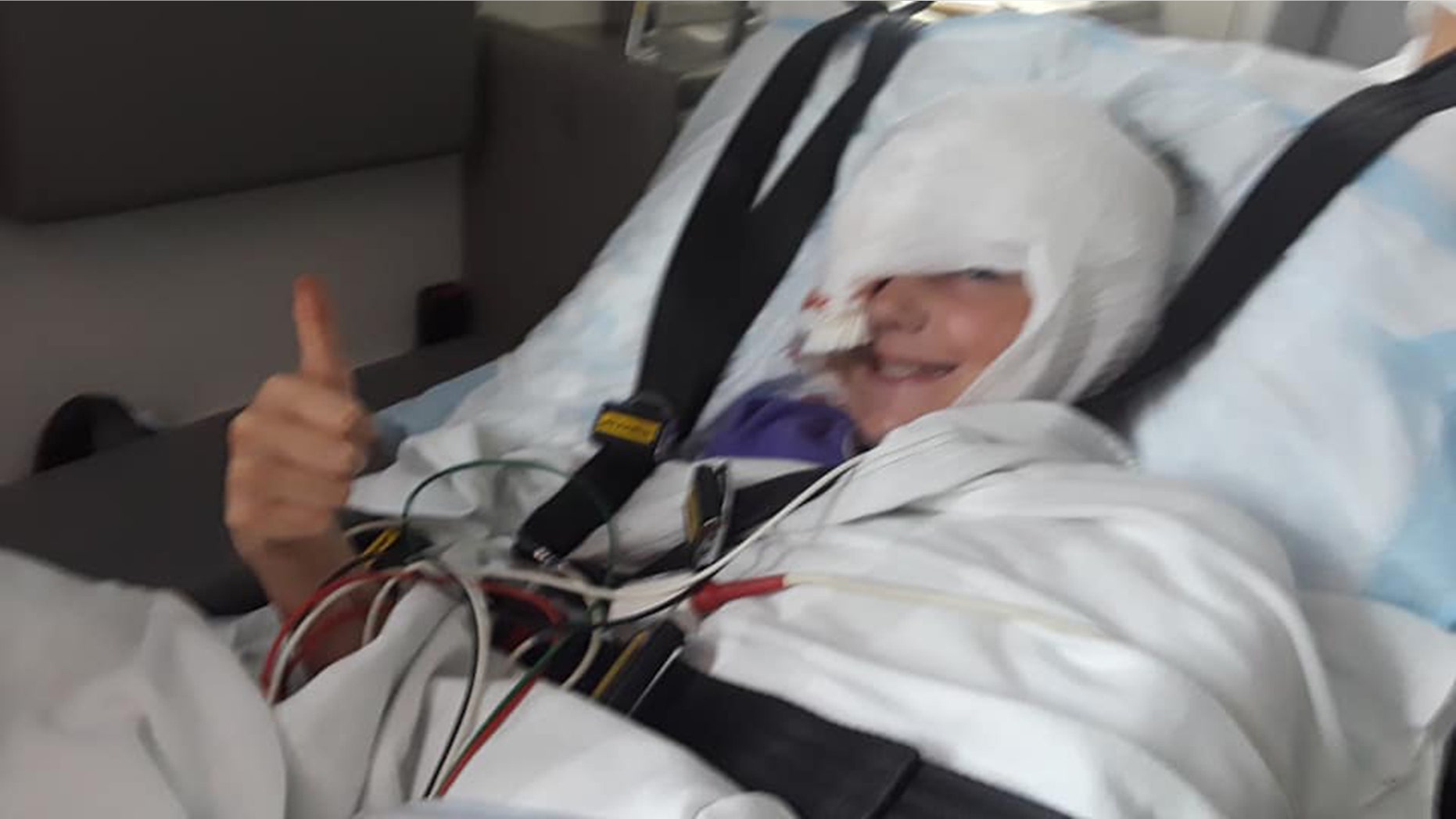 Skylar, 10, was standing behind and off to the side of her father while he mowed the lawn.