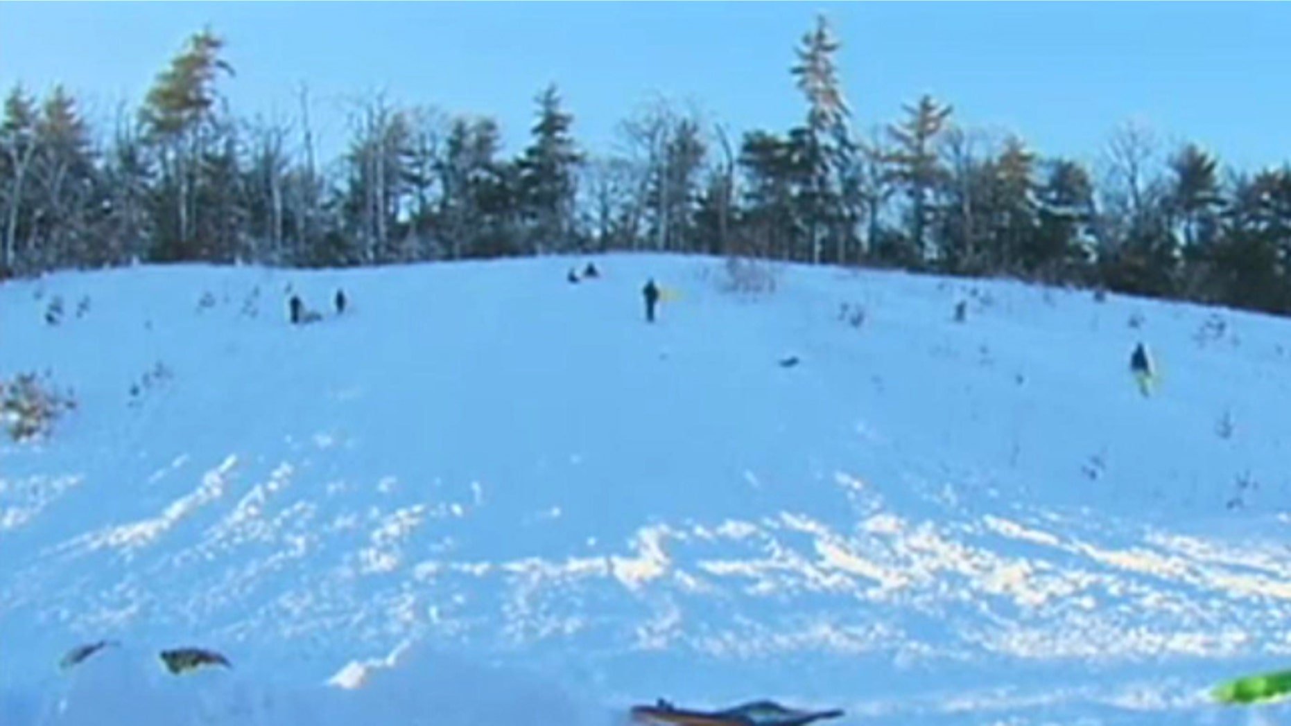 A Massachusetts town has police patrolling to prevent children from sledding down a slope school officials deem dangerous.