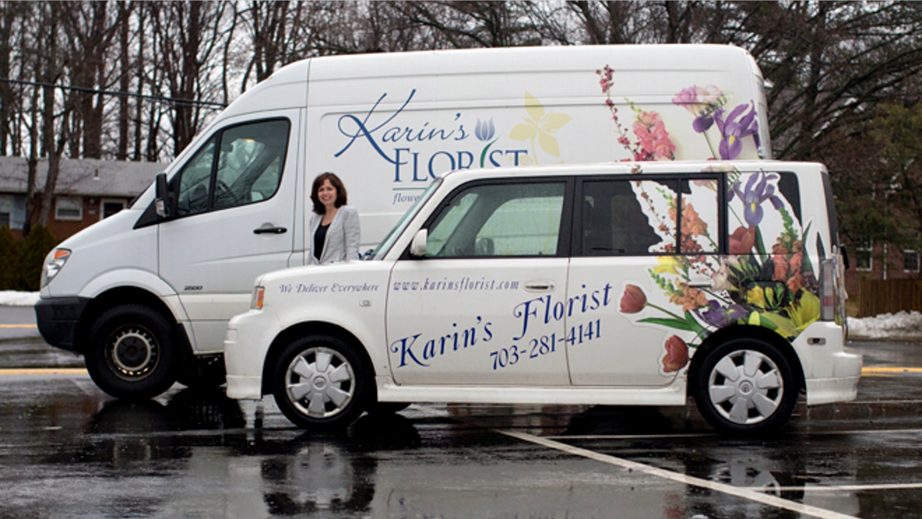 In this Friday, Feb. 21, 2014, photo, Maris Angolia, president of Karin's Florist, stands with two of Karin's Florist's delivery vehicles, a 2006 Scion xB, front, and a 2011 Mercedes-Benz Sprinter, behind, outside Karin's Florist, in Vienna, Va. (AP Photo/Carolyn Kaster)