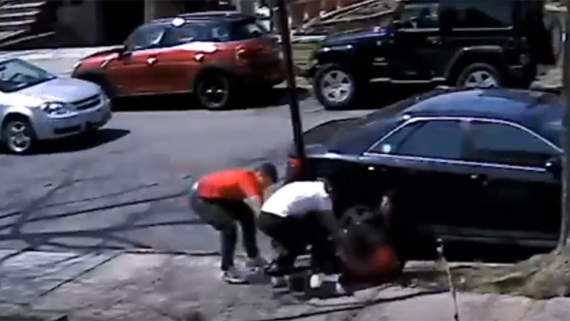 New York City police released surveillance footage showing a teen being robbed of his sneakers during a daylight mugging.