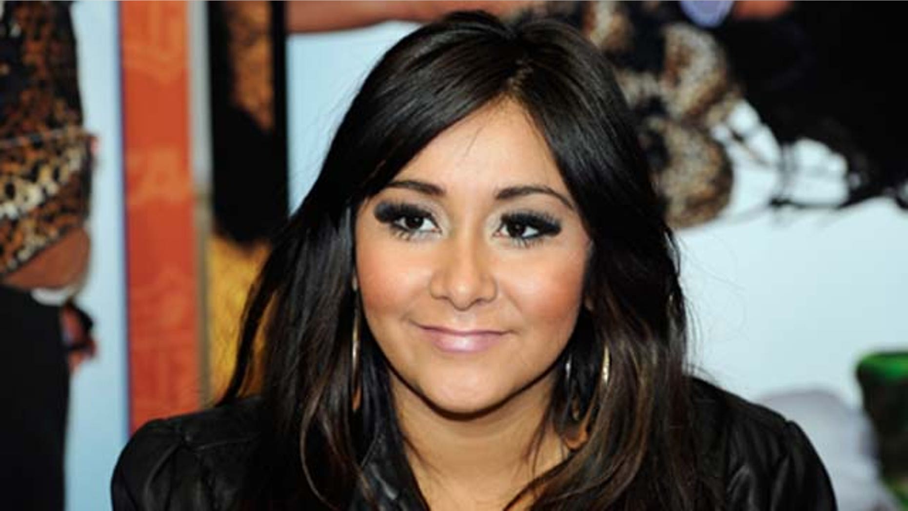 Television personality Nicole "Snooki" Polizzi promotes her Snooki Slippers line licensed by Happy Feet at the MAGIC clothing industry convention at the Las Vegas Convention Center February 15, 2011 in Las Vegas, Nevada.