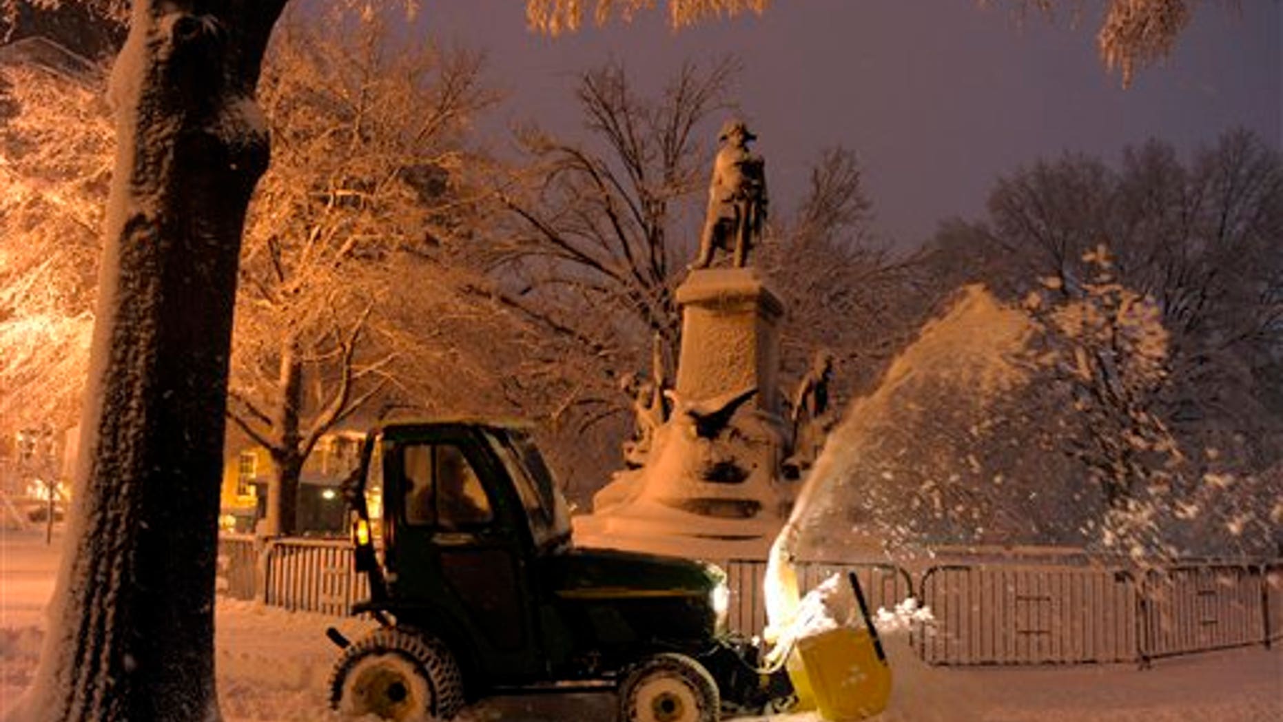 Feb. 6: A worker plows snow to clear a sidewalk in Lafayette Park, across from the White House in Washington.