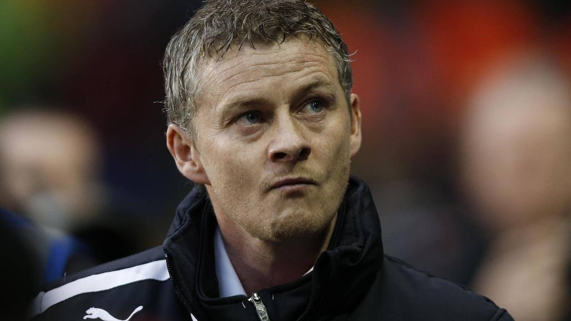 FILE - In this Sunday, March 2, 2014 file photo, Cardiff City's manager Ole Gunnar Solskjaer looks on from the dugout before the start of their English Premier League soccer match against Tottenham Hotspur at White Hart Lane, London. Ole Gunnar Solskjaer has left his position as Cardiff manager, ending the former Manchester United striker's first coaching job in British football after nine months. Cardiff, which was relegated from the English Premier League under Solskjaer last season, says in a statement released Thursday that the Norwegian coach has "stepped down ... with immediate effect following recent discussions." The Welsh club has lost three of its first seven games in the second-tier League Championship. Cardiff owner Vincent Tan says "regrettably our recent results do not justify Ole's continued role as manager at Cardiff." (AP Photo/Sang Tan, file)