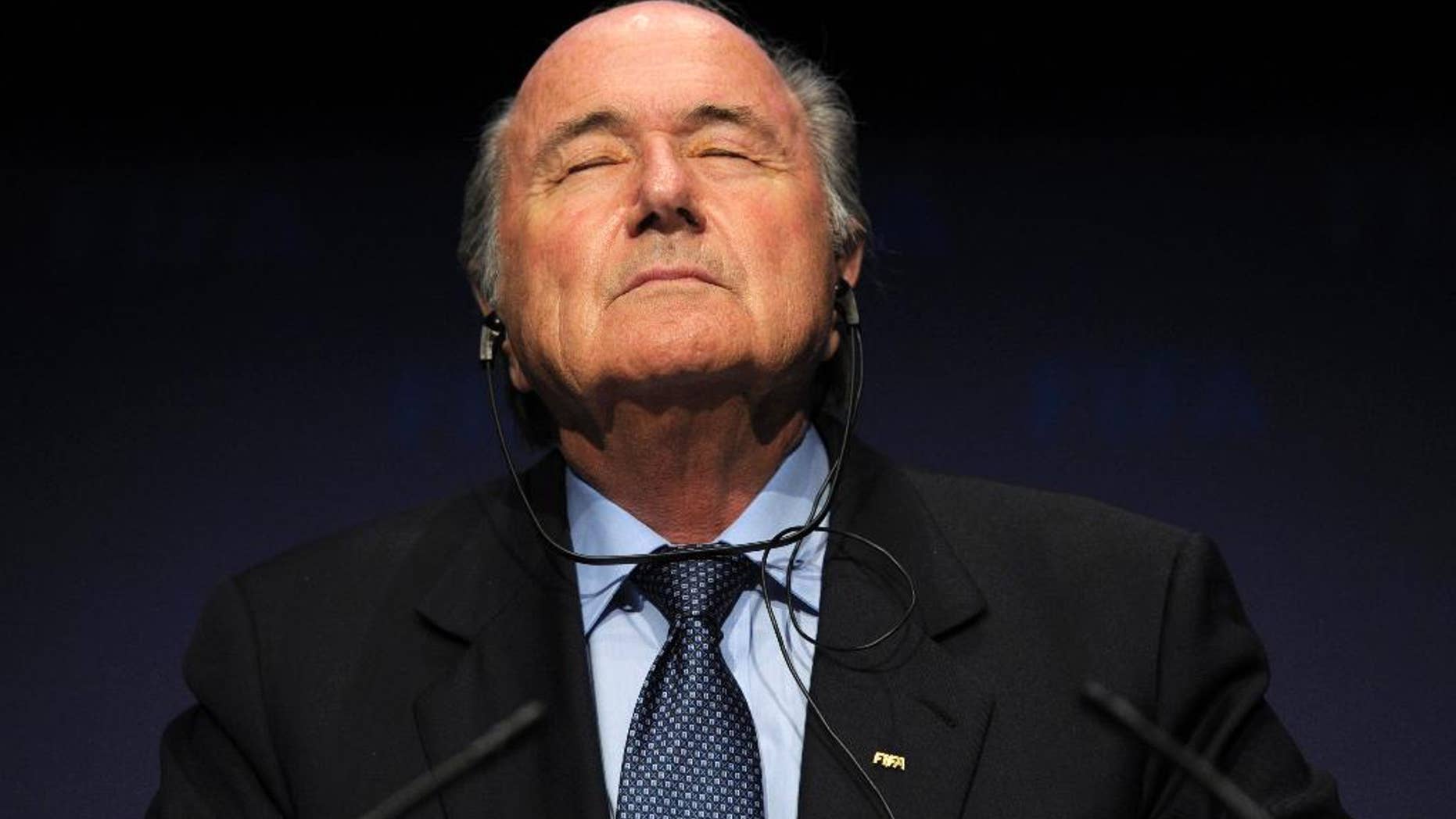 FILE - In this Nov. 19, 2010 file photo FIFA President Sepp Blatter pauses during a press conference following a meeting of the Executive Committee in Zurich, Switzerland. On Friday, Sept. 25, 2015 Swiss attorney general opened criminal proceedings against FIFA President Sepp Blatter. (Steffen Schmidt/Keystone via AP)
