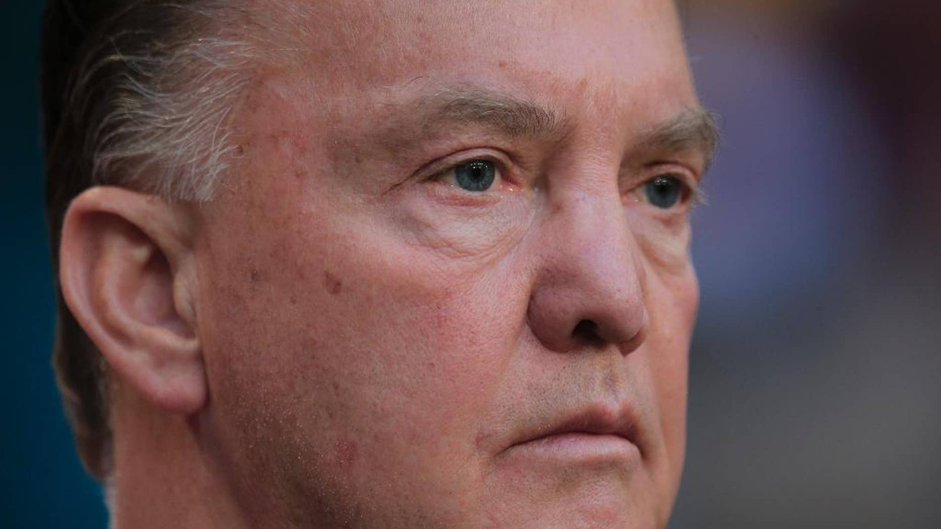 Netherlands' coach Louis van Gaal watches his players during the line up prior to the international friendly soccer match between Netherlands and Ecuador at ArenA stadium in Amsterdam, Netherlands, Saturday, May 17, 2014. (AP Photo/Peter Dejong)