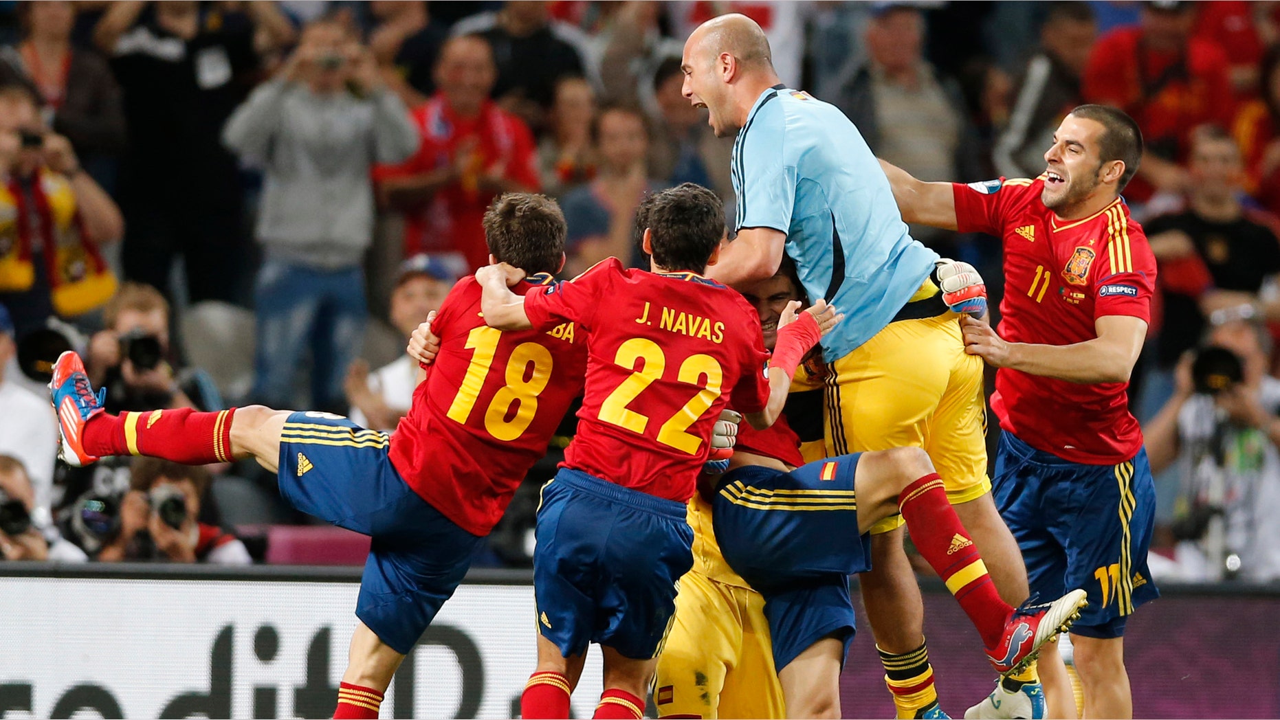 Spanish players celebrate winning the penalty shootout during the Euro 2012 soccer championship semifinal match between Spain and Portugal in Donetsk, Ukraine, Wednesday, June 27, 2012. (AP Photo/Antonio Calanni)