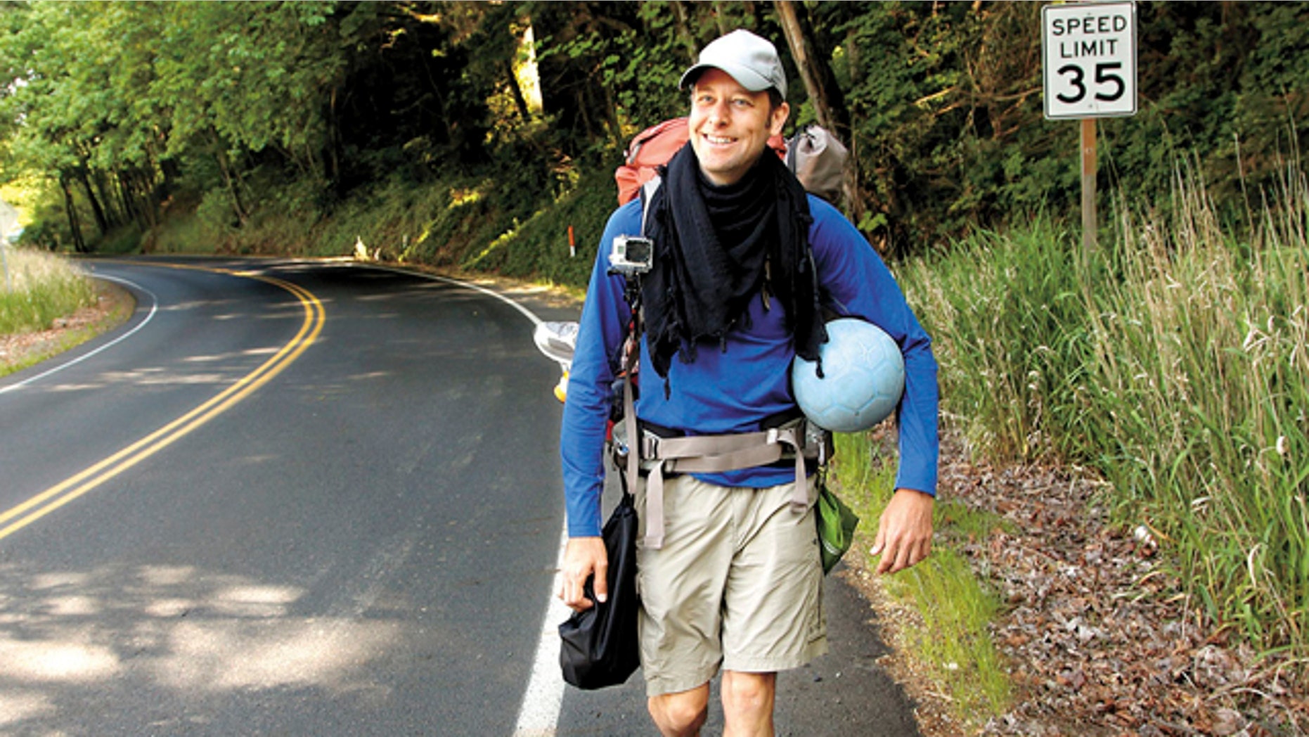 May 7, 2013: Richard Swanson, of Seattle, walks along a road in Kelso, Wash.