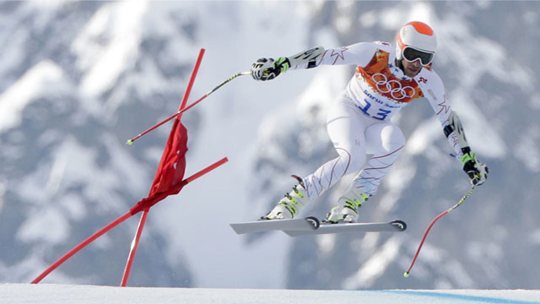 February 16, 2014: Joint bronze medal winner Bode Miller of the United States makes a jump in the men's super-G at the Sochi 2014 Winter Olympics in Krasnaya Polyana, Russia. (AP Photo/Charlie Riedel)