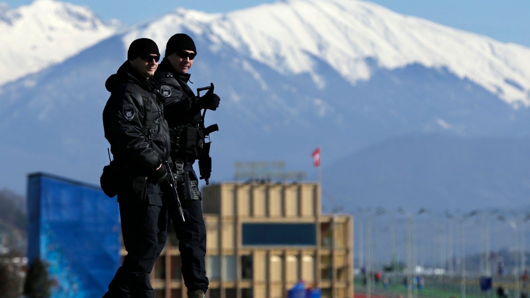 Feb. 7, 2014 - Heavily-armed Russian military flash a "thumbs up" while patrolling Olympic Park prior to opening ceremony at the 2014 Winter Olympics.