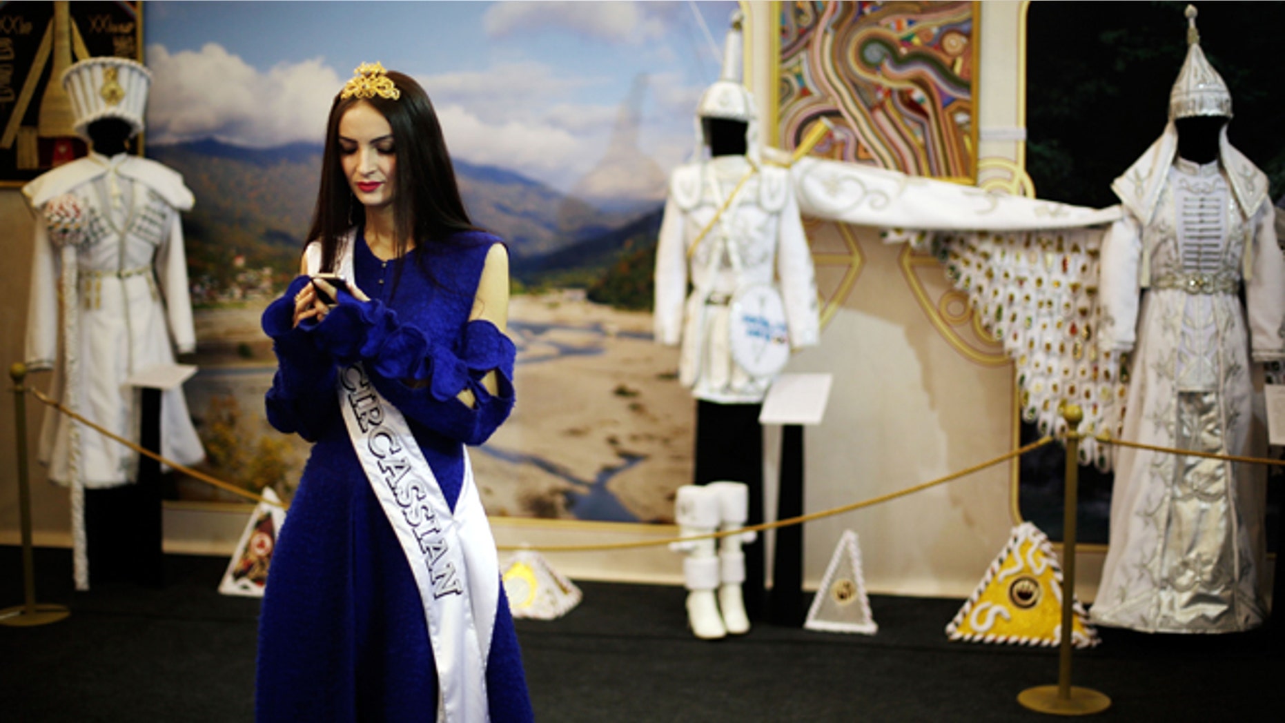 Feb. 14, 2014: In this photo, Bella Kukan, Miss Circassia from the town of Maikop, waits to greet visitors during a folk theatre troupe performance at the Circassian House in Olympic Park at the 2014 Winter Olympics in Sochi, Russia. The Circassians, an ethnic group indigenous to the land now hosting the Olympics, are using the games to call the worlds attention to their culture and history, which includes massacres by imperial Russian armies and persecution by Stalin.