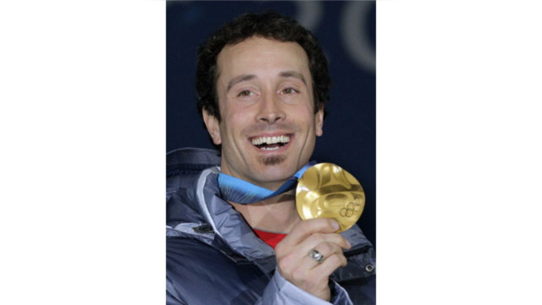 FILE - In this Tuesday, Feb. 16, 2010 photo USA's gold medalist Seth Wescott shows off his medal at the men's snowboard cross medal ceremony at the Vancouver 2010 Olympics in Vancouver, British Columbia. (AP Photo)