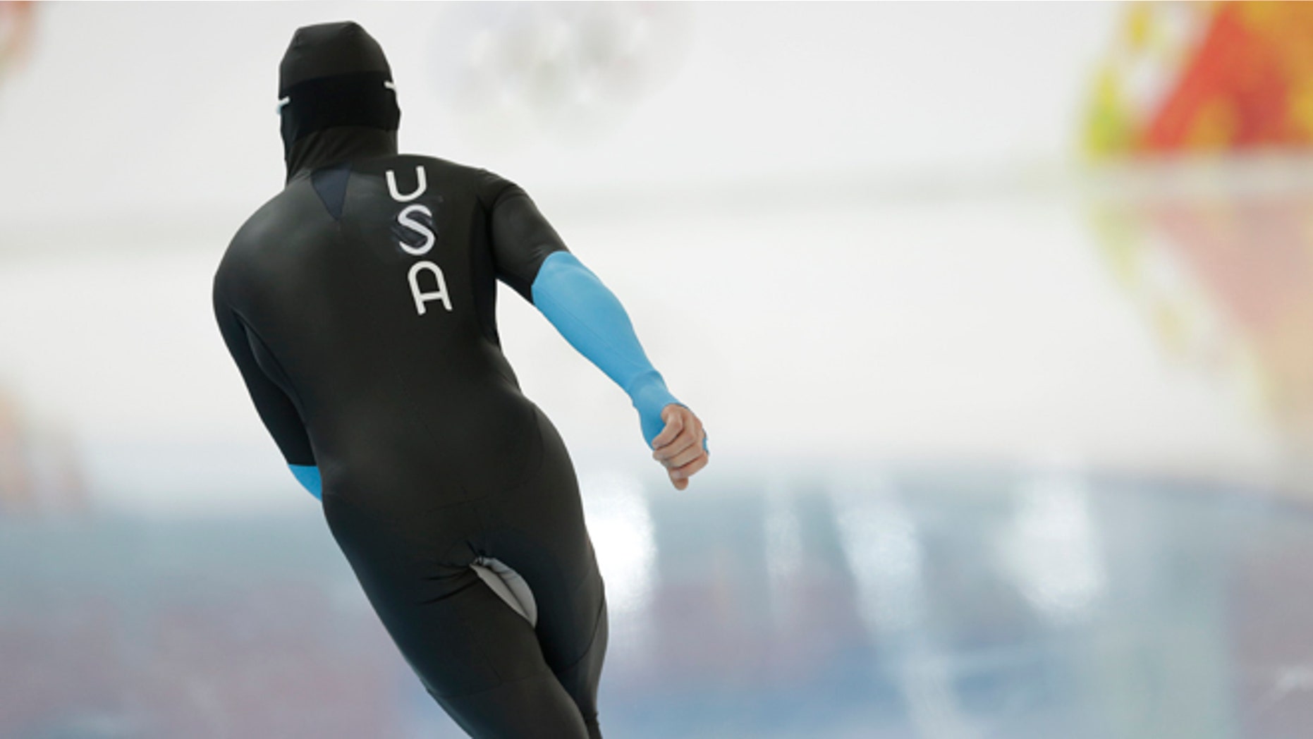 U.S. speedskater Joey Mantia warms-up wearing the old World Cup race suit, prior to the men's 1,500-meter race at the Adler Arena Skating Center during the 2014 Winter Olympics in Sochi, Russia, Saturday, Feb. 15, 2014. U.S. skaters are looking to bounce back from an awful start to their Olympics by slipping back into their old suits that should have been made obsolete by new high-tech gear. (AP Photo/Patrick Semansky)