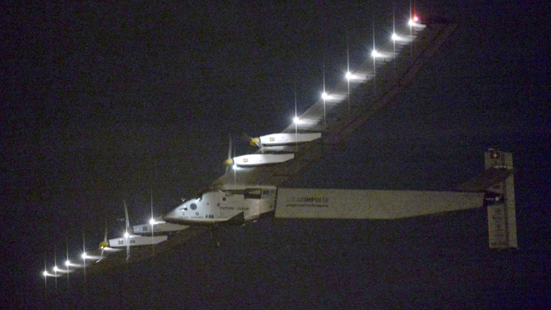 The Solar Impulse 2 flies over Nagoya Airport after taking off in Toyoyama, near Nagoya, central Japan.