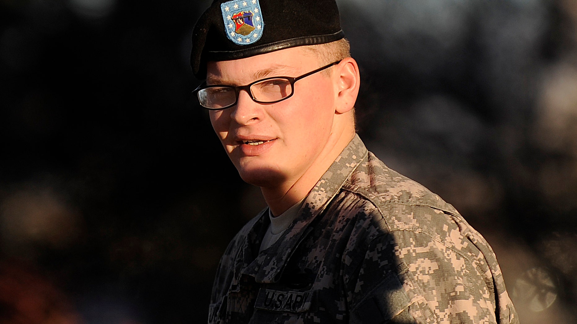 Nov. 30: Pfc. David Lawrence takes a break from an Article 32 hearing at Fort Carson, Colo. Lawrence is charged with fatally shooting a jailed Taliban leader he was supposed to be guarding in Afghanistan. His lawyer portrays him as a young man afflicted with schizophrenia and depression and given scant medical care after asking the Army for help.