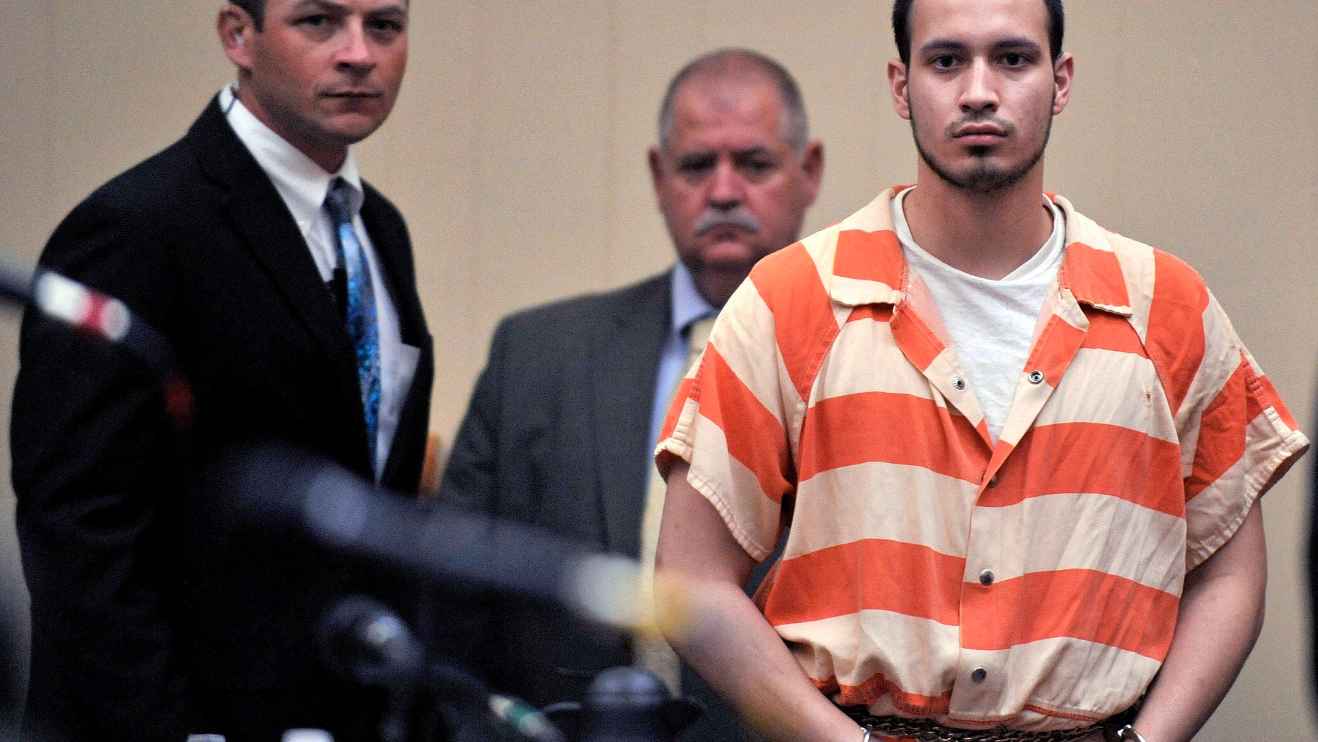 Aug. 30, 2012: In this file photo, Pvt. Isaac Aguigui walks into the courtroom during a preliminary hearing at Long County Superior Court in Ludowici, Ga.
