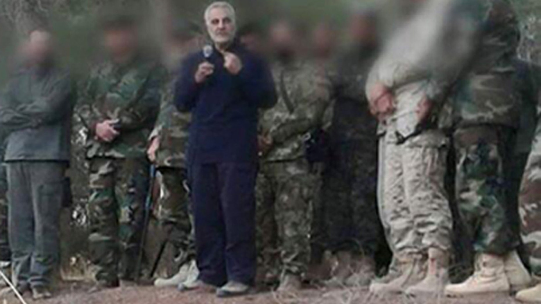 Maj. Gen. Qassem Soleimani, seen in blue suit, is commander of Iran's Islamic Revolutionary Guards Quds Force.