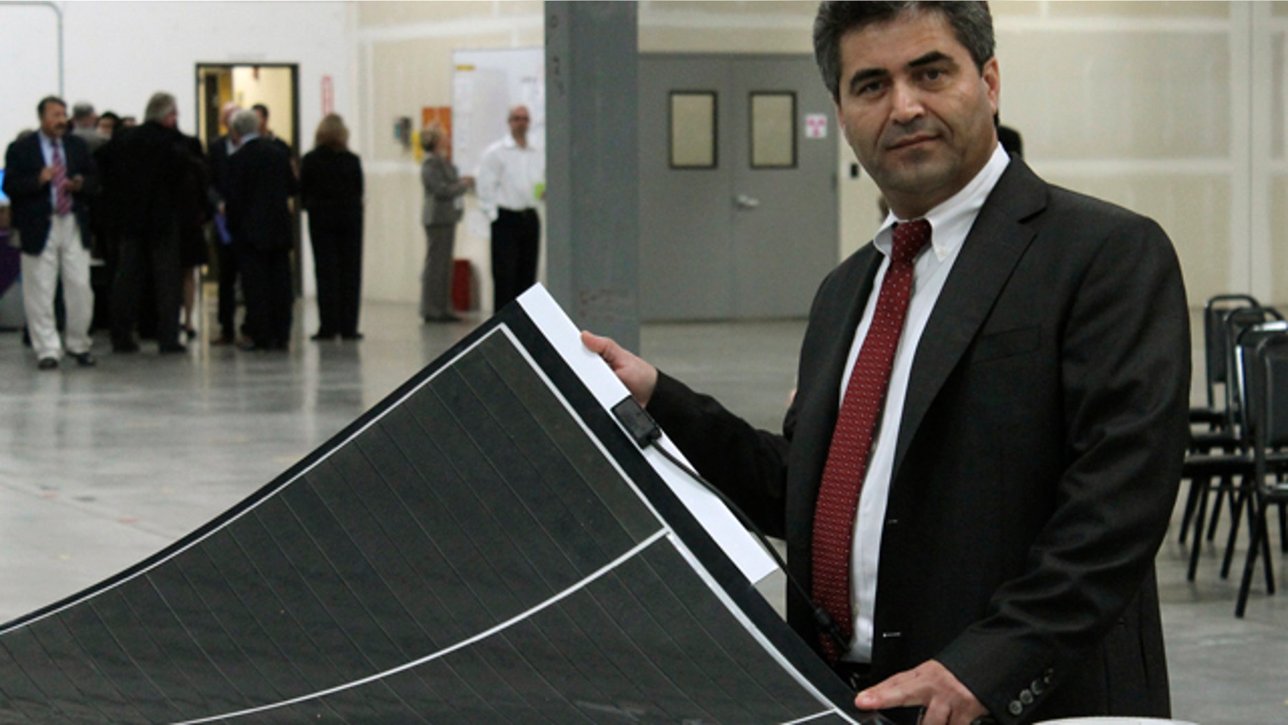 FILE: Chief Technology Officer Mustafa Pinarbasi is shown in the SoloPower factory in Portland, Oregon.