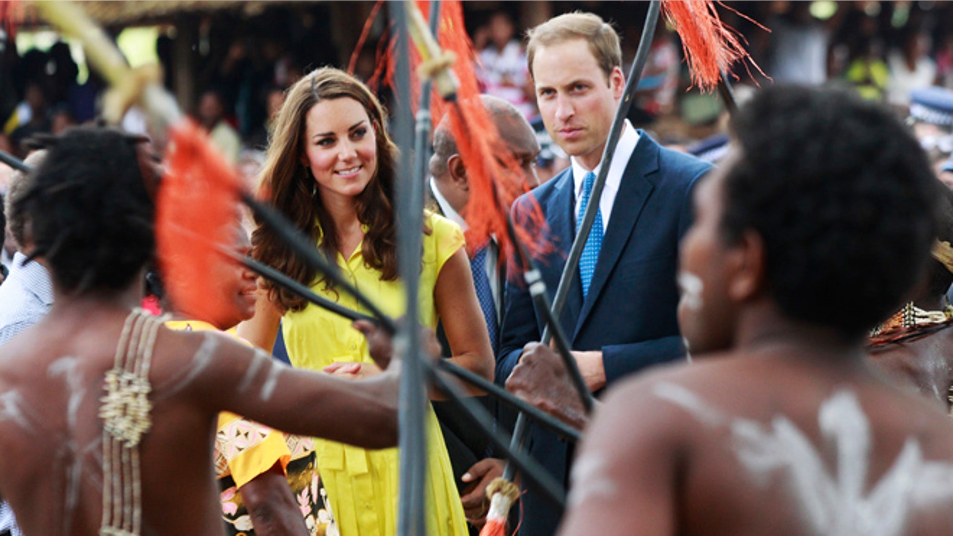 Sept. 17, 2012: Britain's William and his wife Kate, top center, the Duke and Duchess of Cambridge, watch a traditional dance at the Cultural Village in Honiara, Solomon Islands.