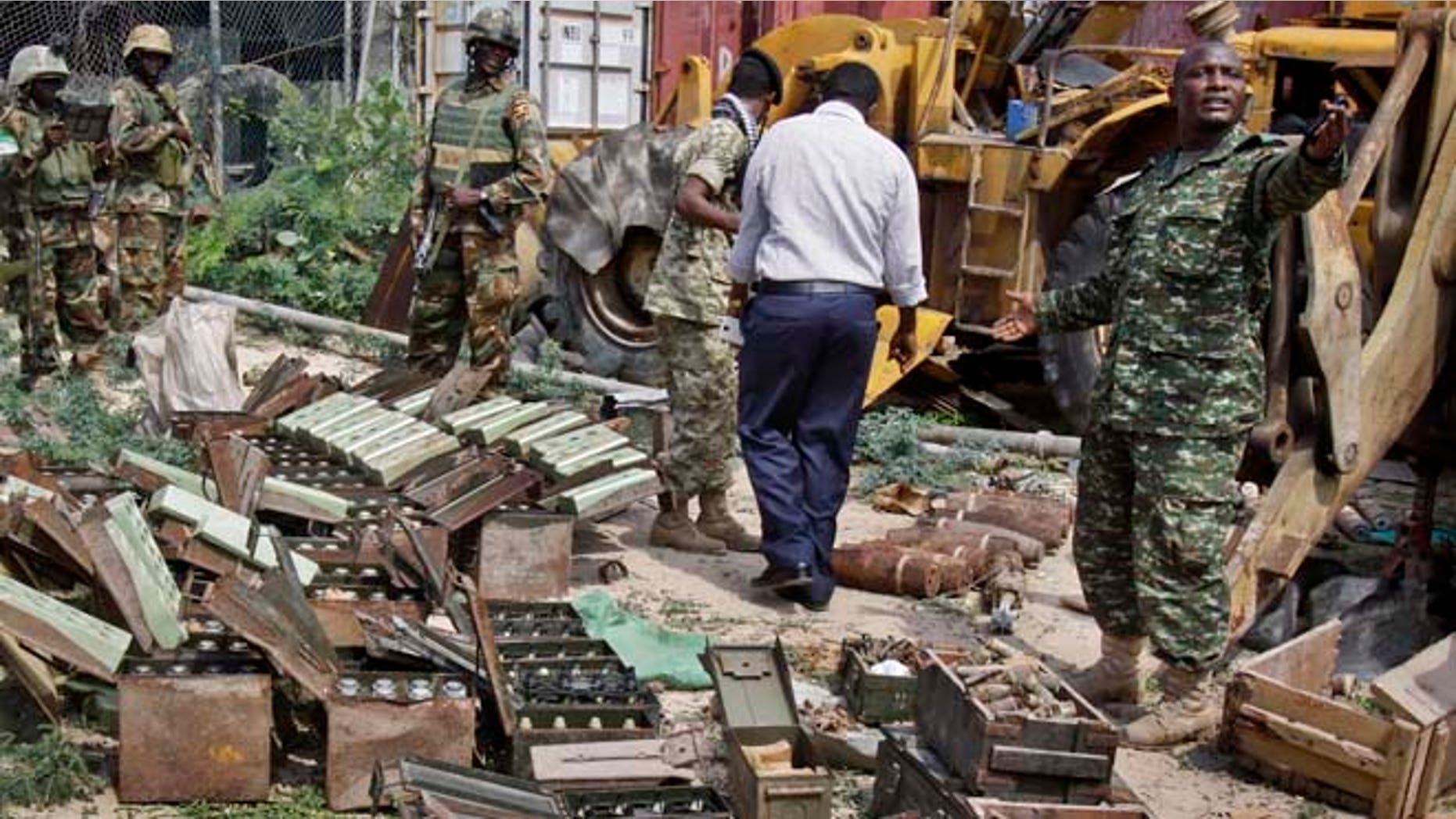 July 27, 2014: In this photo, African Union (AU) peacekeepers stand near a cache of weapons recovered from a garage in Mogadishu, Somalia. (AP)