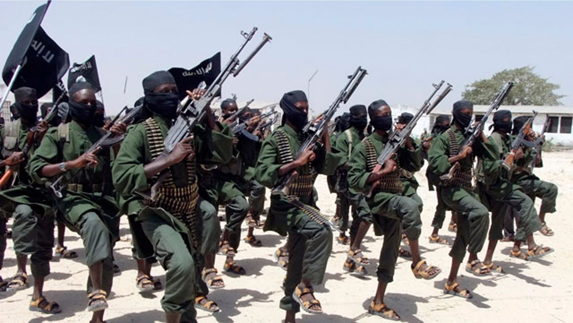 FILE - In this Thursday, Feb. 17, 2011 file photo, hundreds of newly trained al-Shabab fighters perform military exercises in the Lafofe area south of Mogadishu, in Somalia. (AP Photo/Farah Abdi Warsameh, File)