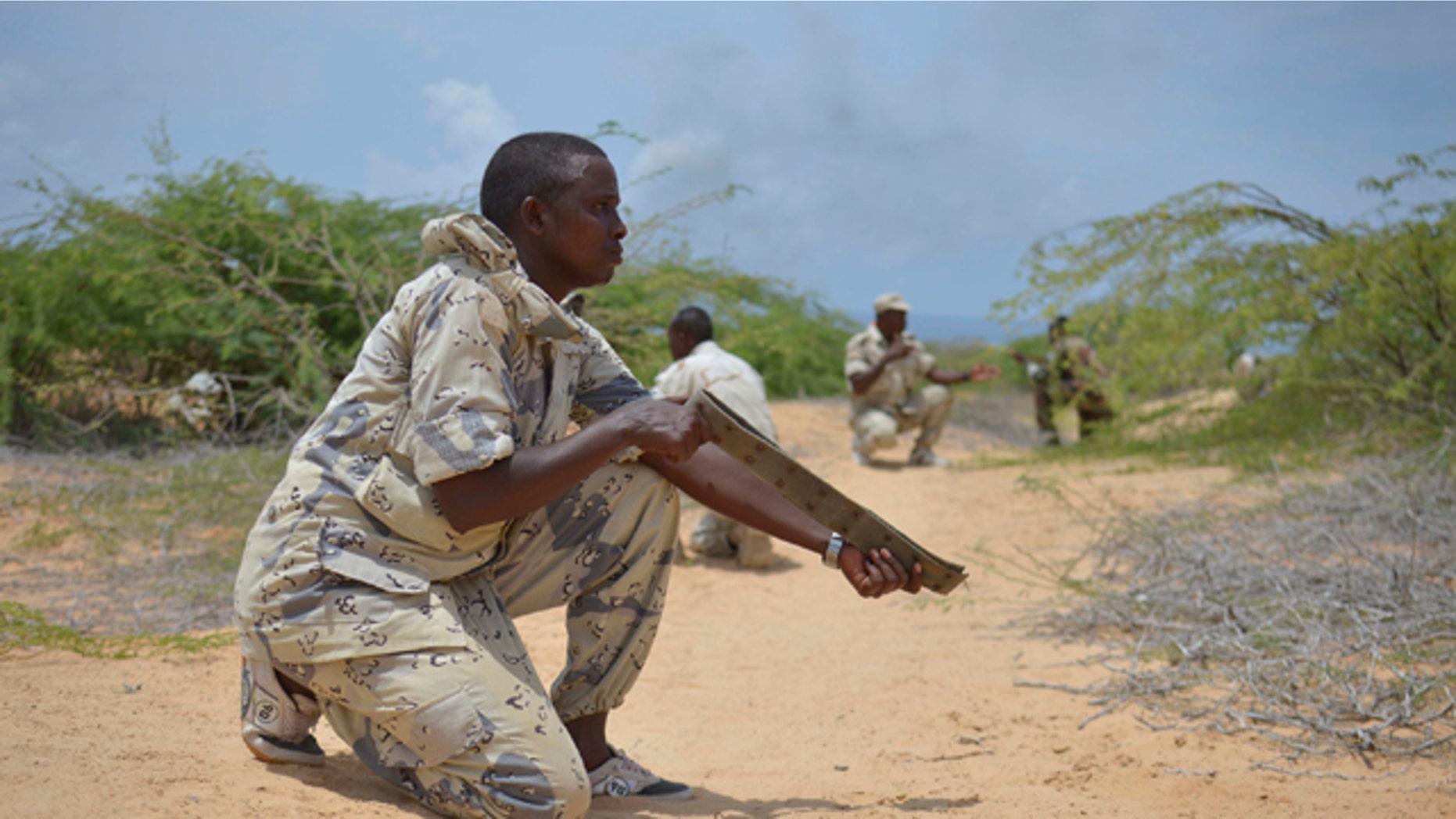 Mar. 29, 2013: A soldier from the Somali National Army (SNA) uses a belt acting as a weapon during a training exercise in Mogadishu.