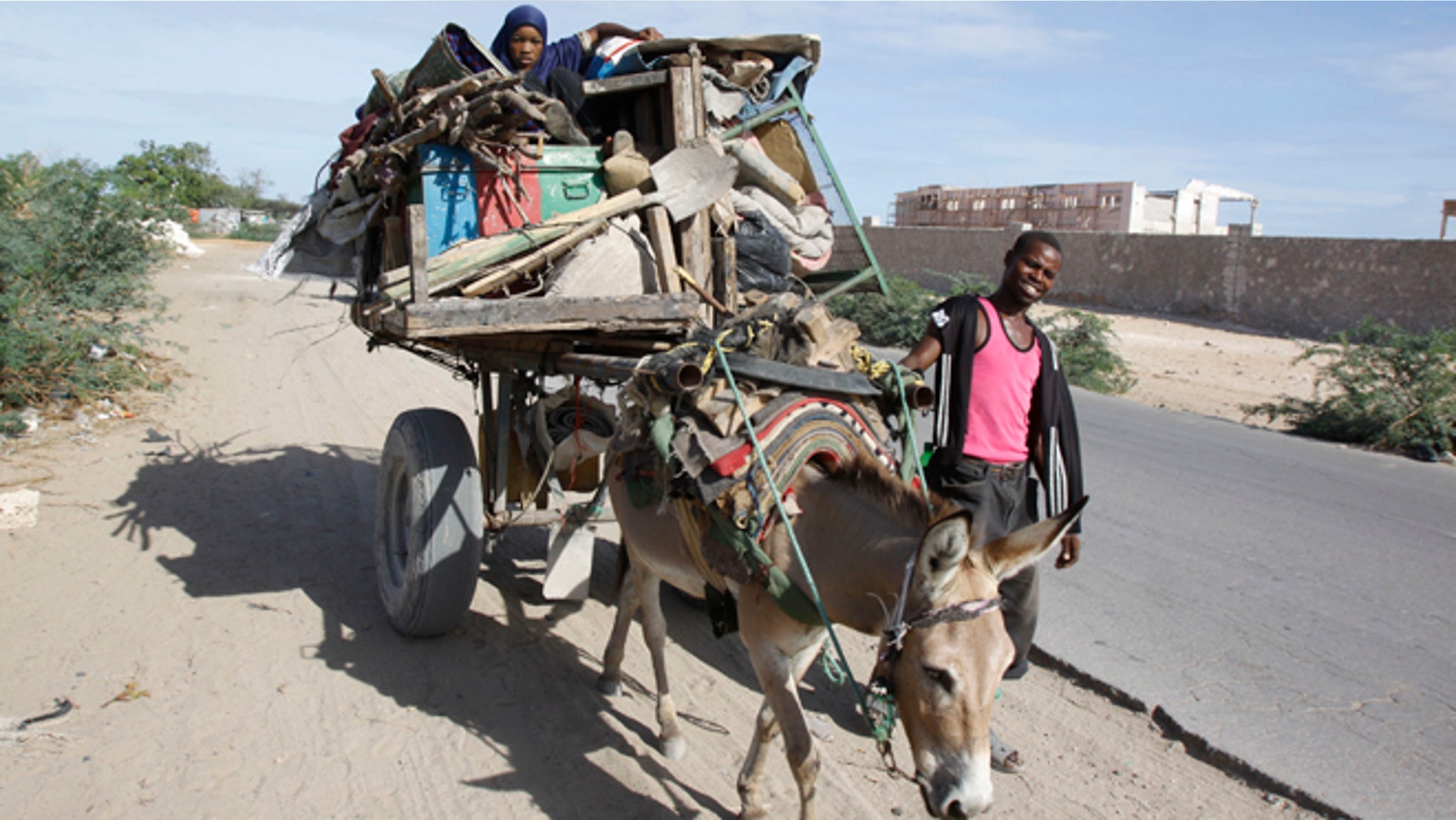 May. 7, 2014: A Somali refugee girl on a donkey fleeing the Somali capital due to hunger, to a refugee camp, in Mogadishu, Somalia.
