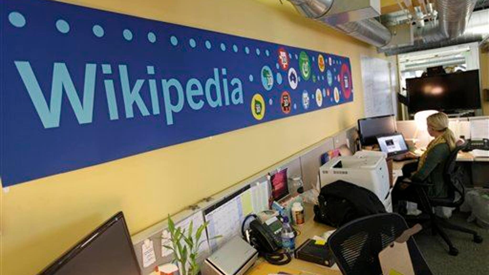 Mallory Whitt works at her desk at the offices of the Wikipedia Foundation in San Francisco, Wednesday, Jan. 18, 2012.
