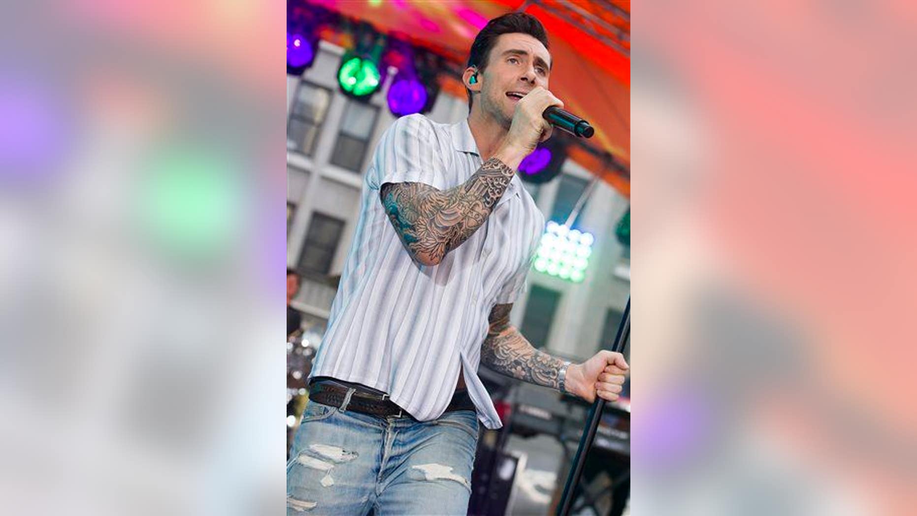 Adam Levine from Maroon 5 performs.