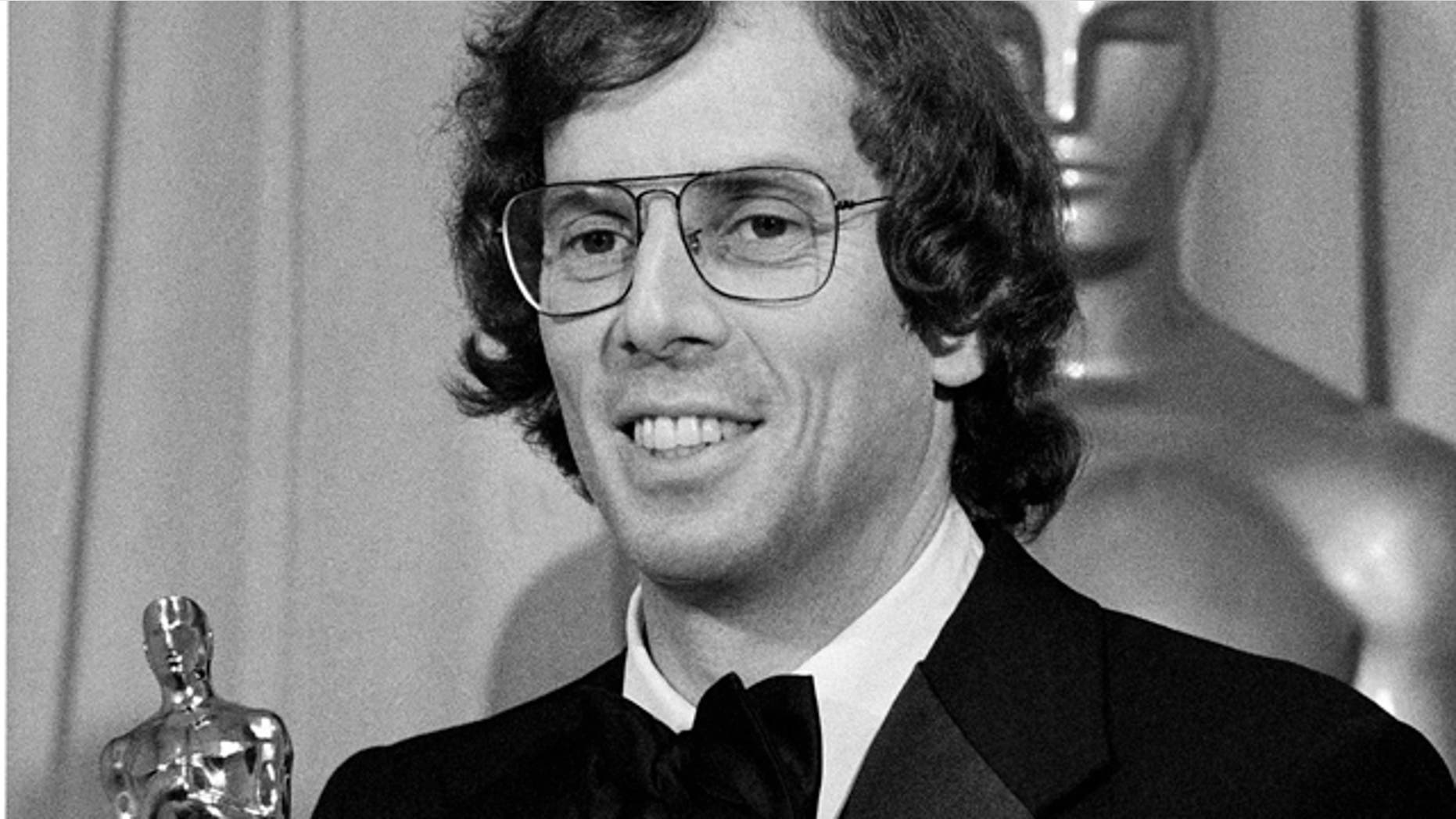 In this April 3, 1978 file photo, songwriter Joseph Brooks smiles as he holds his Oscar for best original song for "You Light Up My Life," in Los Angeles. Brooks was found dead Sunday, May 22, 2011 of an apparent suicide in his Manhattan apartment, police said. He was 73.