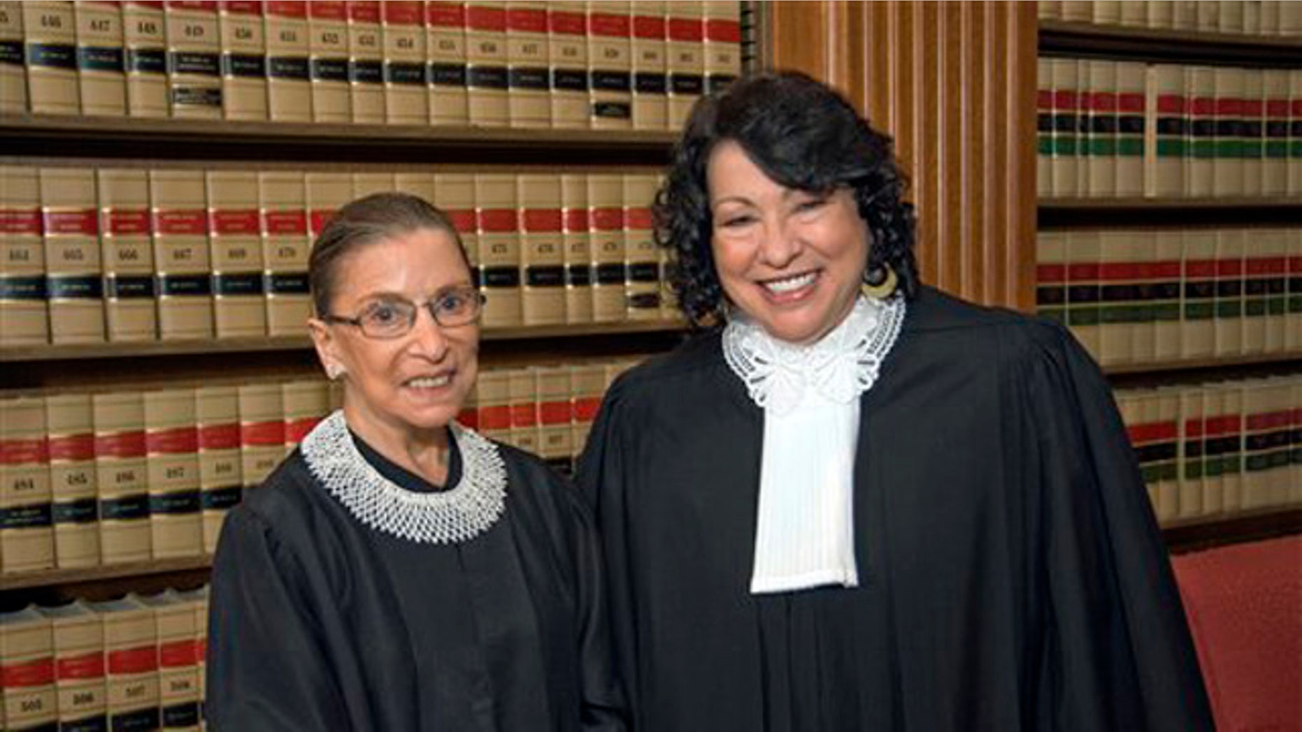 FILE - In this file photo, released Sept. 8, 2009 by the Supreme Court of the United States, Justice Ruth Bader Ginsburg, left, and Justice Sonia Sotomayor pose for a photo in the Justices' Conference Room at the court in Washington. First Amendment cases top the Supreme Court's docket as it begins a new term with a new justice and three women on the bench for the first time. (AP Photo/Collection of the Supreme Court of the United States, Steve Petteway, File)