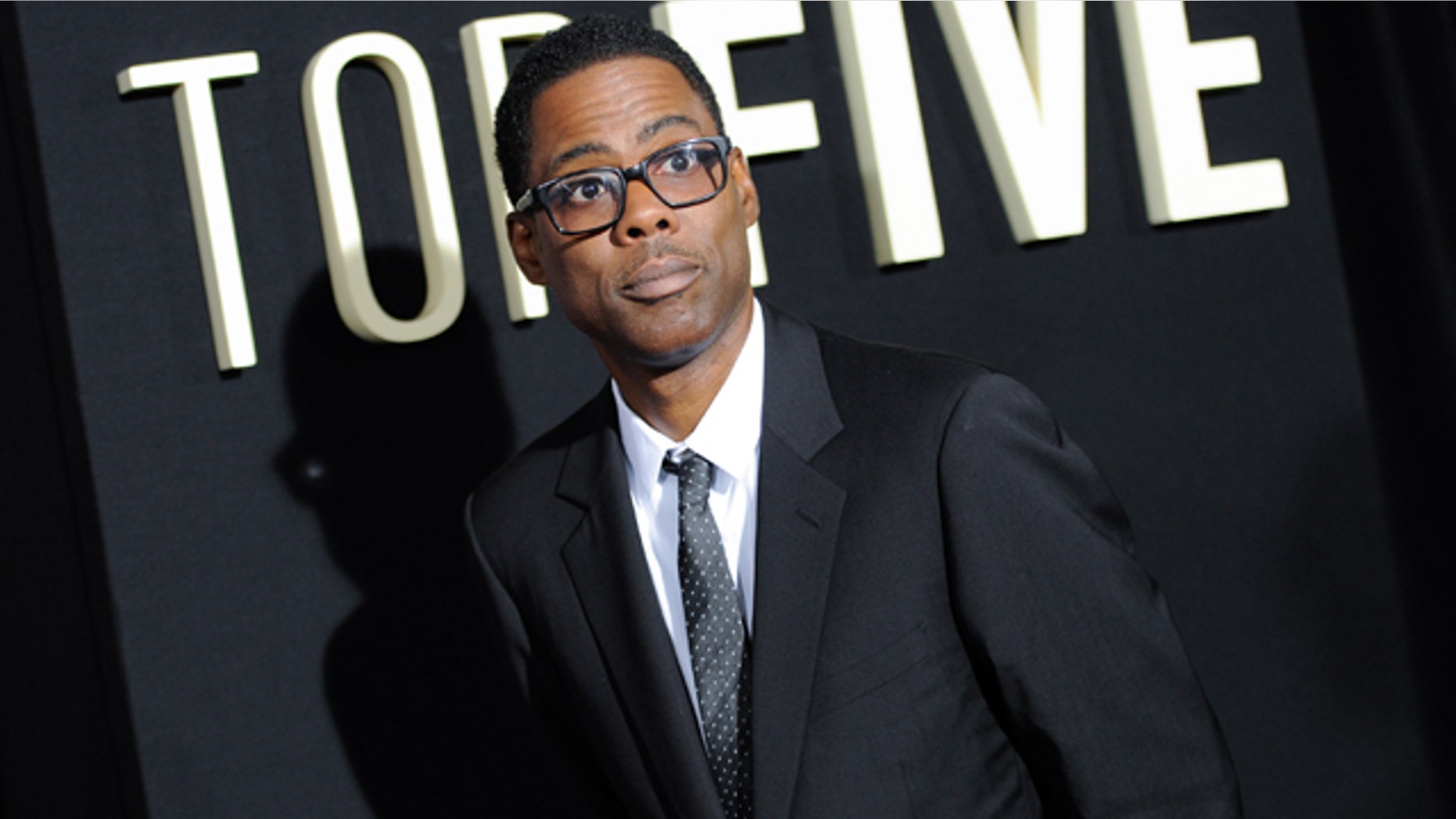 FILE - In this Dec. 3, 2014 file photo, actor Chris Rock attends the premiere of 'Top Five' at the Ziegfeld Theatre in New York. (Photo by Evan Agostini/Invision/AP, File)