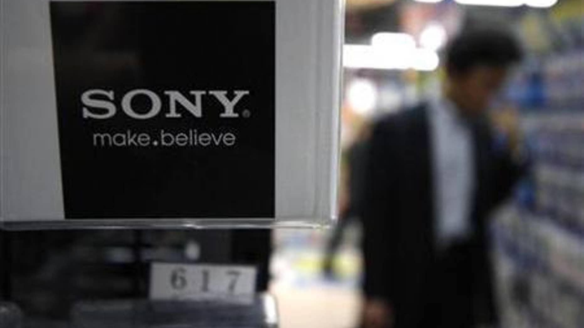 A man looks at Sony Corp's products at an electronics store in Tokyo May 26, 2011.