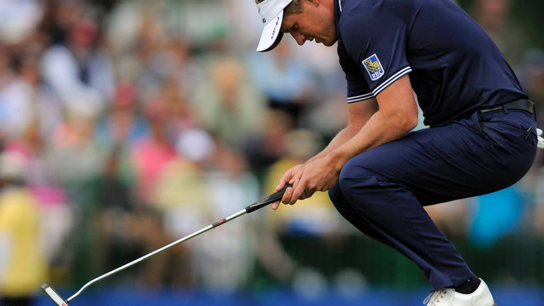 FILE - In this April 20, 2014, file photo, Luke Donald, of England, reacts after missing a birdie putt on the 17th green during the final round of the RBC Heritage golf tournament in Hilton Head Island, S.C. Some of the biggest stars in Europe are starting their year in Abu Dhabi on Thursday. Donald is in Honolulu. That's by design. This year is about getting back to his strengths, and getting back to his roots. Donald could pick off a few European Tour requirements, but he tends to play well during the West Coast Swing on the PGA Tour, and that's where he will start. And thus begins what he hopes will be the road back at the Sony Open. (AP Photo/Stephen B. Morton, File)
